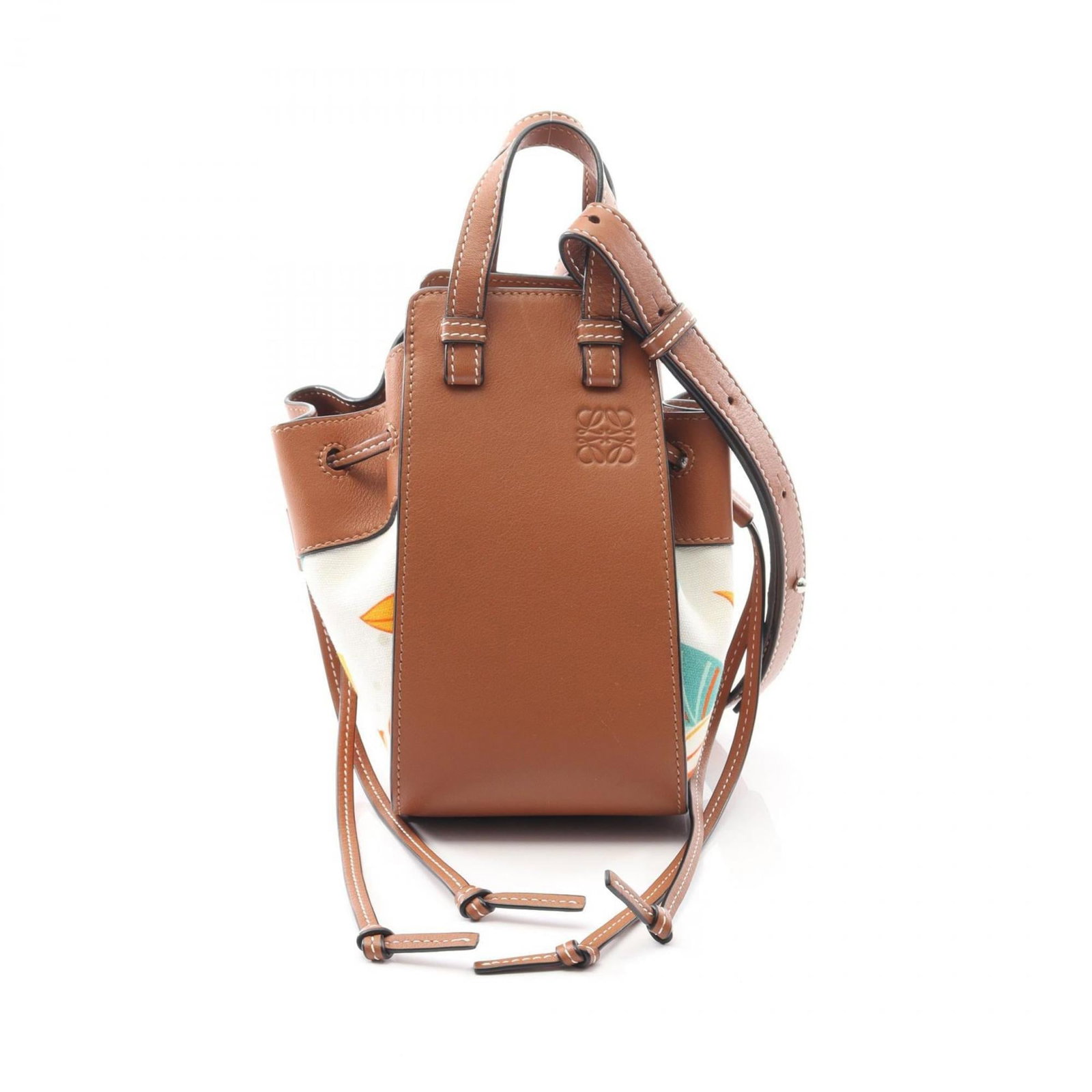 Loewe Handbag Canvas Leather: Loewe Handbag Canvas Leather Canvas and leather combine in a classic design, with a brown and multi-color pattern. The handbag measures 19cm x 10.5cm x 16.5cm and features a shoulder strap that can be