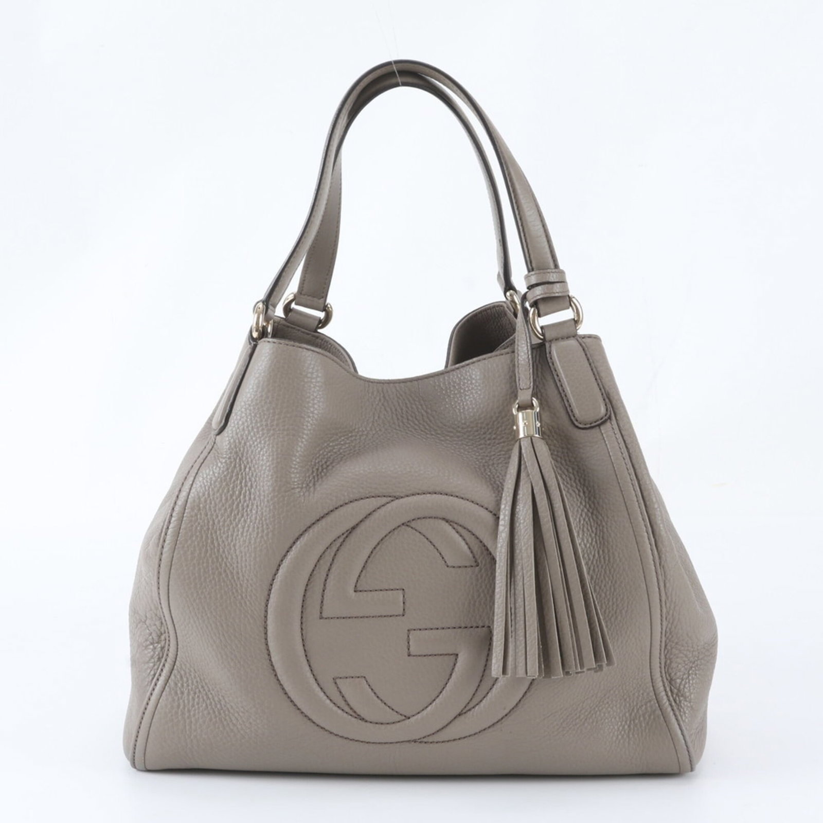 Gucci leather tote bag: Gucci leather tote bag Gucci's Soho line tote bag boasts sleek, gray leather construction with clean lines and a timeless design. Measuring 30cm x 35cm x 15cm, it features a sturdy handle length of 37