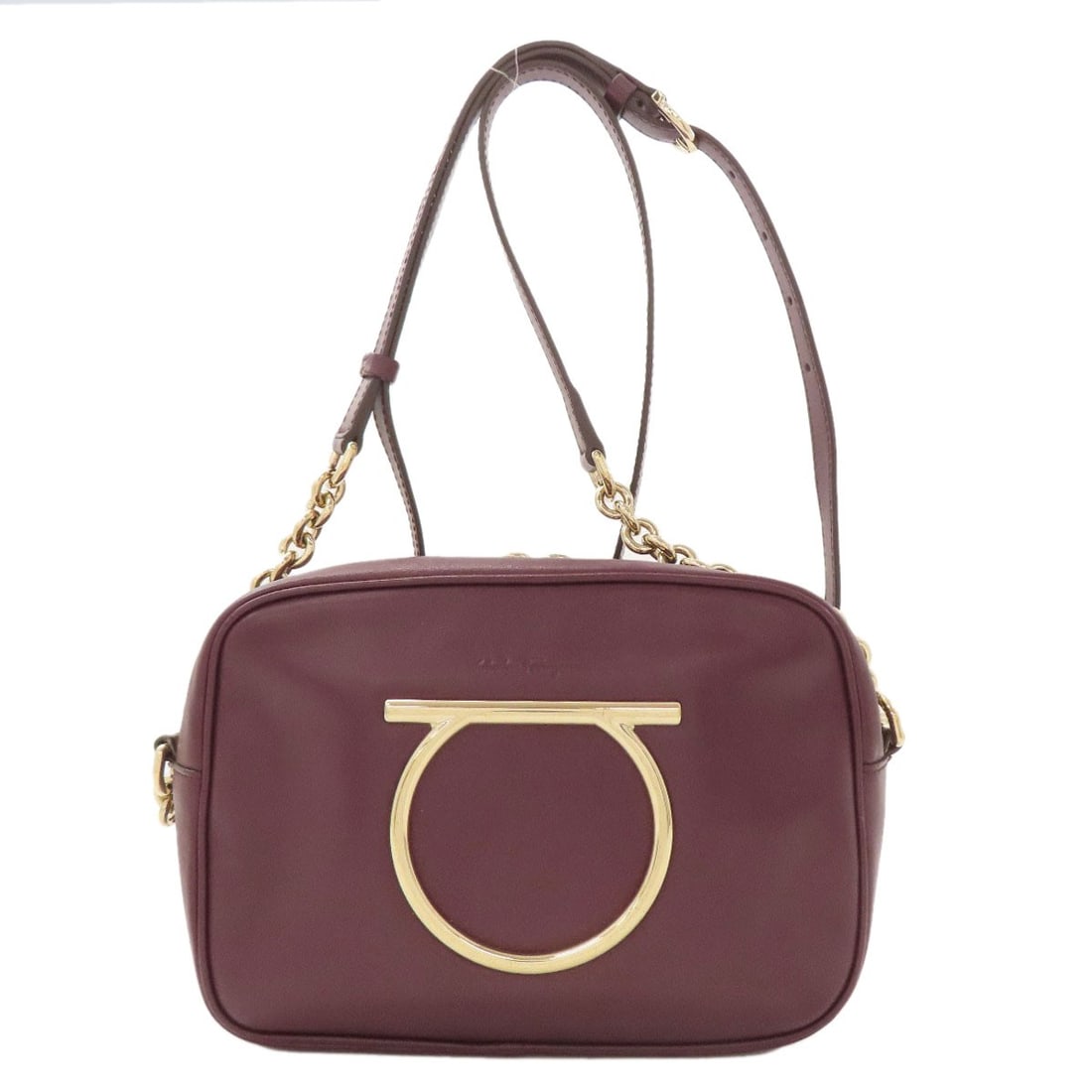 Salvatore Ferragamo Gancinihardware Shoulder Bag Leather: Salvatore Ferragamo Gancinihardware Shoulder Bag Leather Red leather shoulder bag with Salvatore Ferragamo Gancini hardware. This iconic design showcases the brand's signature style, featuring bold re