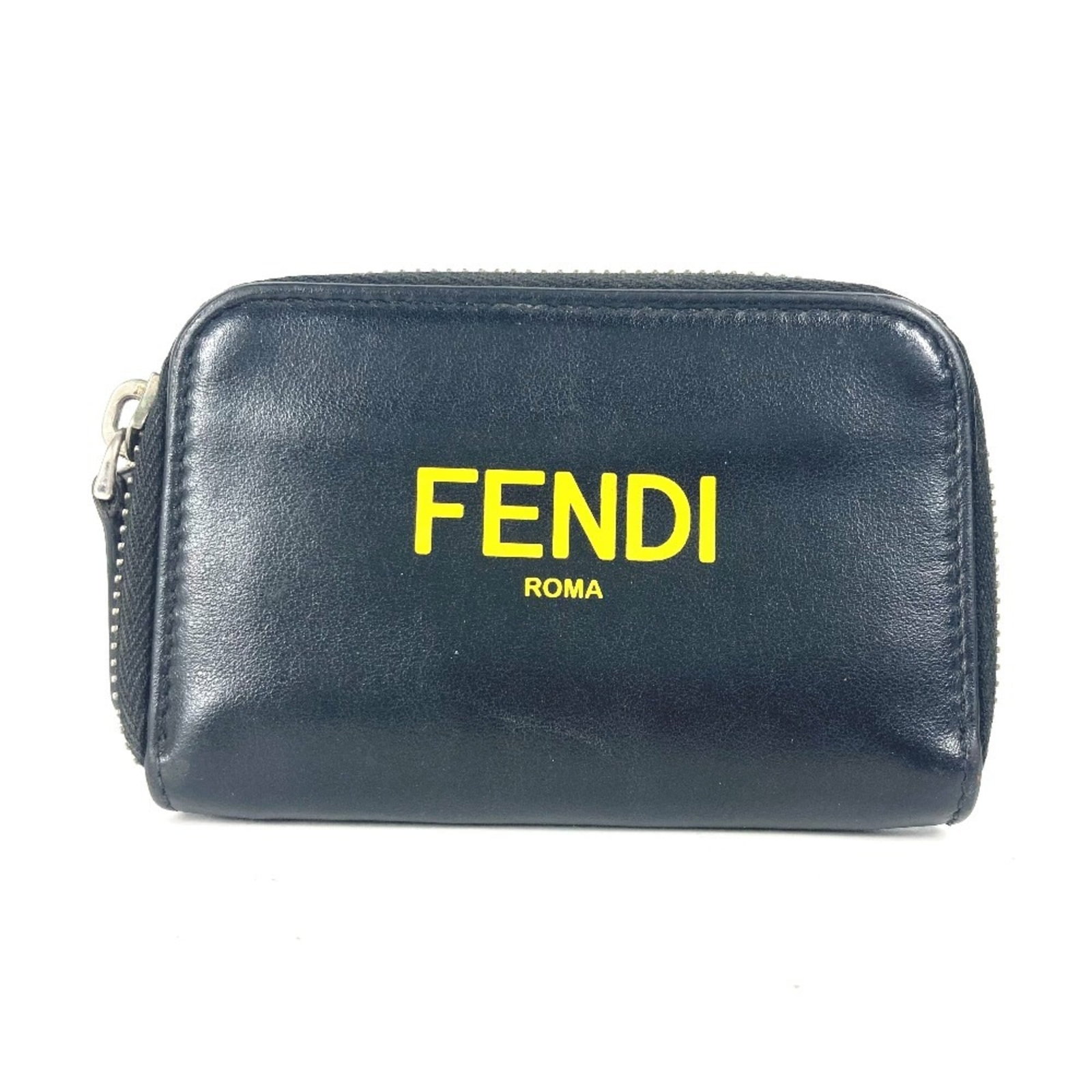 Fendi Coin Purse/ Coin Case Leather: Fendi Coin Purse/ Coin Case Leather The Fendi Coin Purse/ Coin Case Leather is a sleek and stylish accessory made from high-quality Italian leather. With its classic logo design, it features a secure 