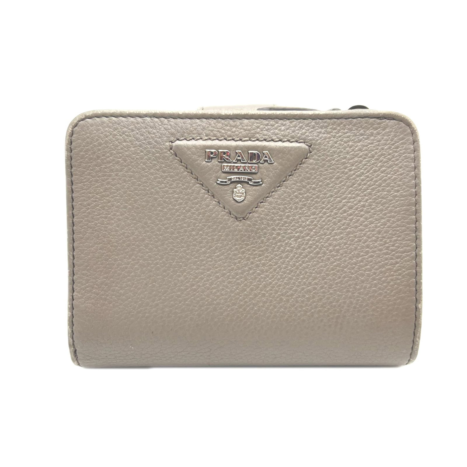 Prada Wallet (Bi-Fold) Leather: Prada Wallet (Bi-Fold) Leather Prada's bi-fold wallet features premium leather construction, with a timeless grayish color and classic design. Made from high-quality calfskin, the wallet measures 9.5c