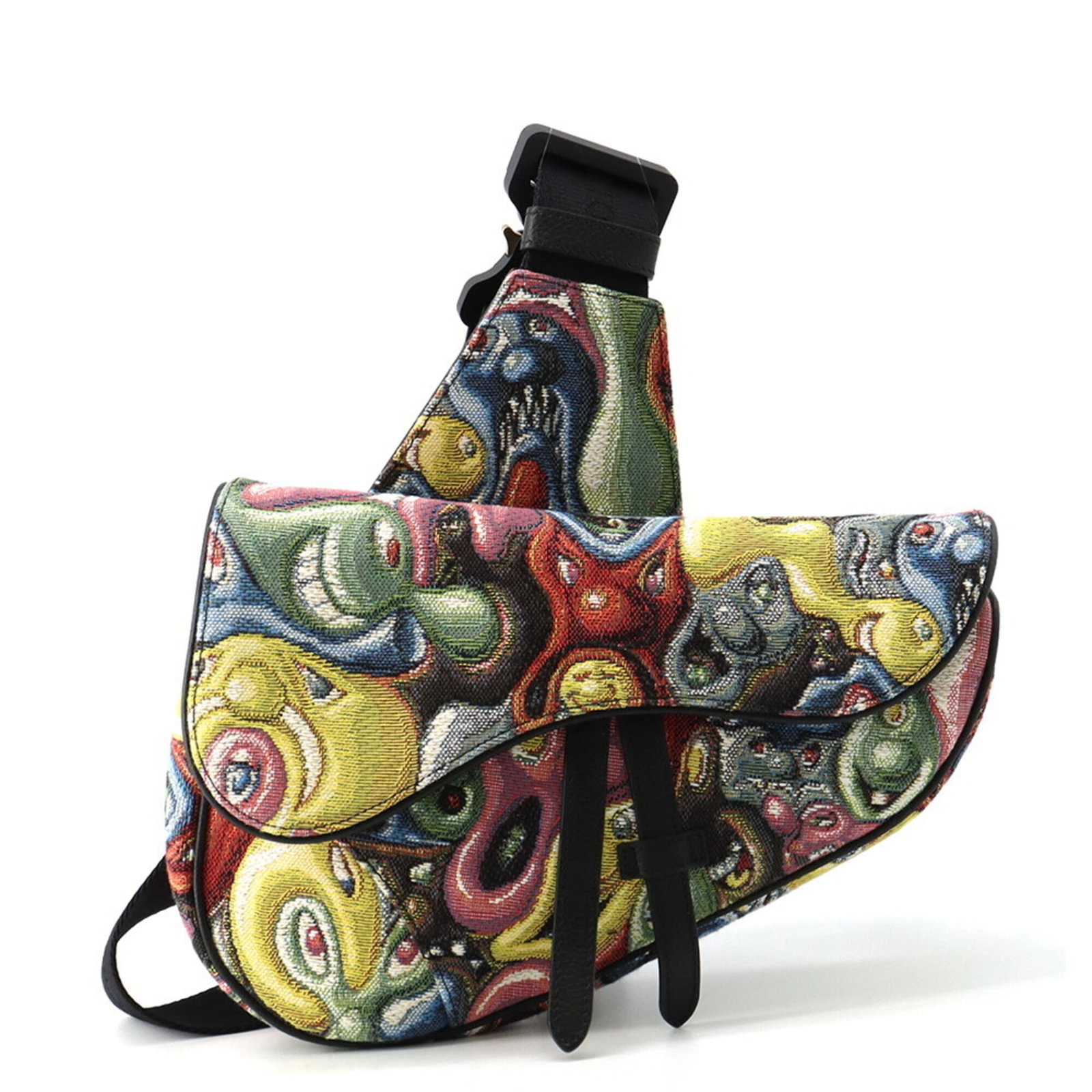 Christian Dior leather canvas saddle sling bag: Christian Dior leather canvas saddle sling bag The Christian Dior leather canvas saddle sling bag boasts a unique multi-color design, combining canvas and leather materials in a striking way. Its silv