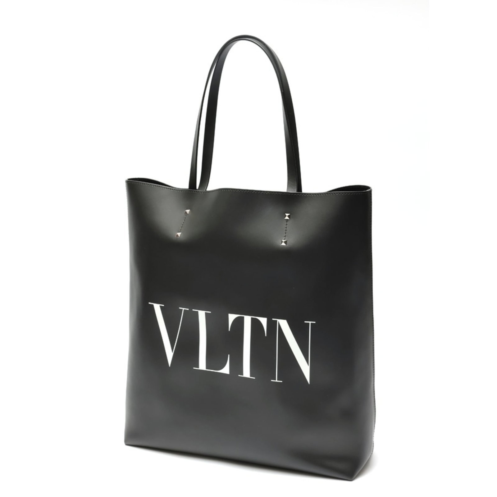 Bag leather tote Valentino: Bag leather tote Valentino Valentino's iconic leather tote bag boasts sleek black design and durable construction. Crafted from high-quality leather, this stylish accessory features a timeless silhoue