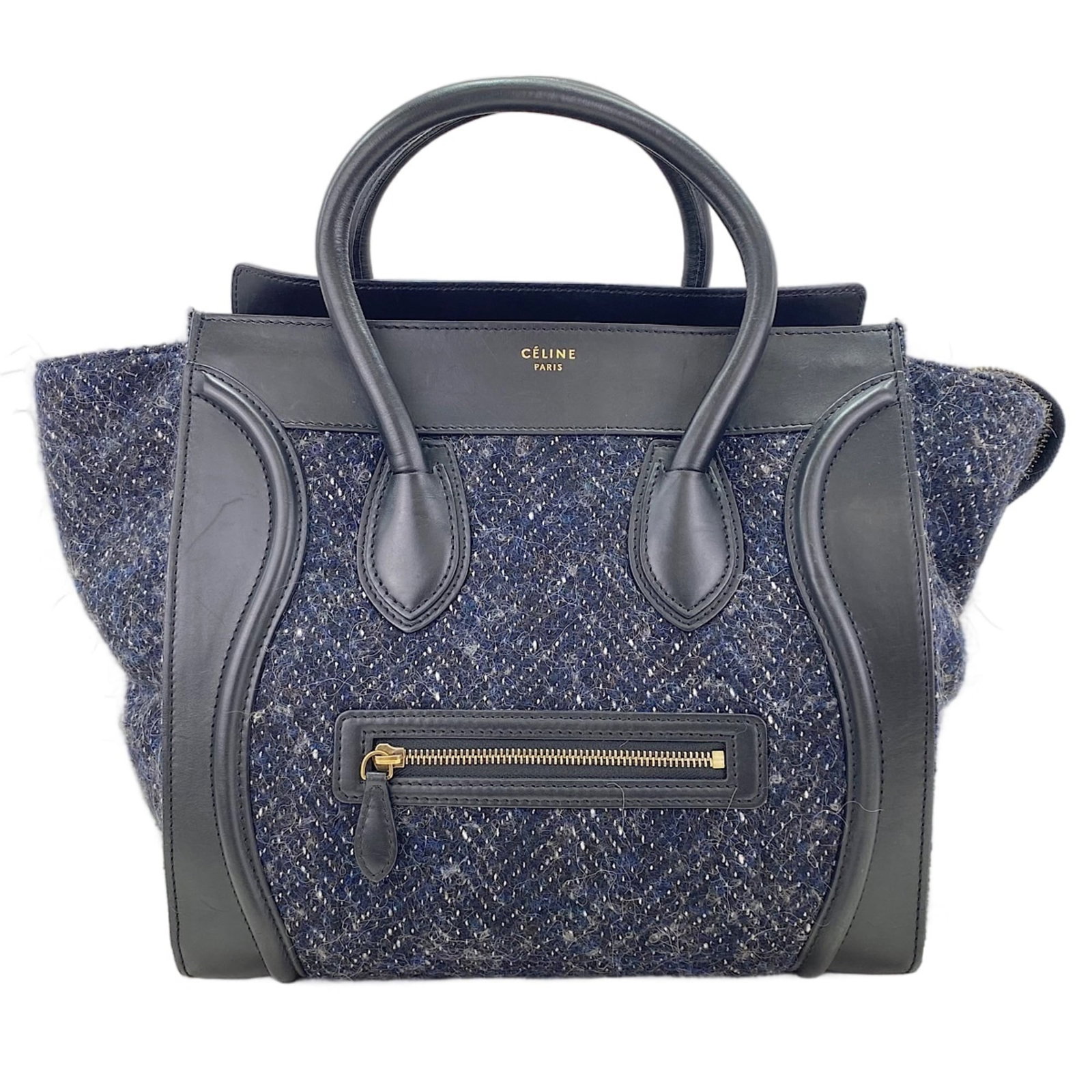 Handbag by Celine: Handbag by Celine Navy Celine handbag with clean lines and classic design, measuring 30cm x 30cm x 18cm. This Italian-made bag features a timeless silhouette that exudes elegance and sophistication. I
