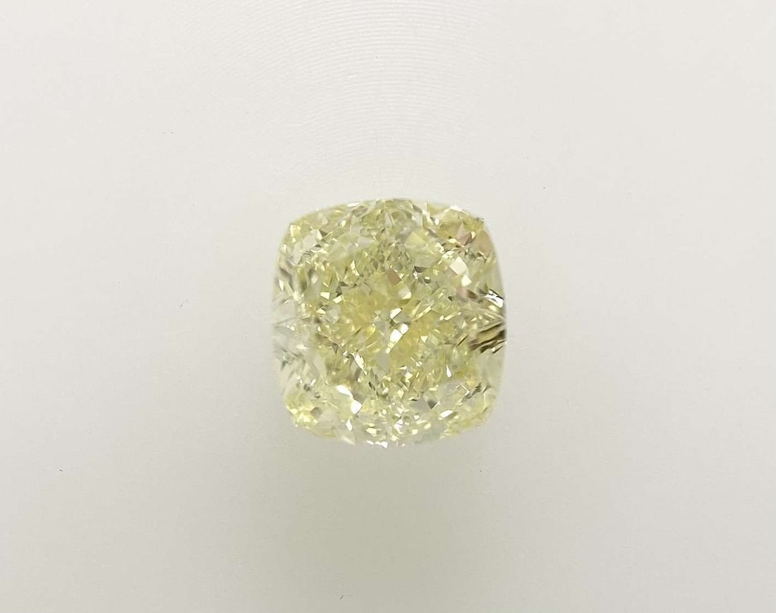 GIA Cushion Brilliant 1.0ct Fancy Light Yellow VVS2 - Loose Natural Diamond: GIA Cushion Brilliant 1.0ct Fancy Light Yellow VVS2 - Loose Natural Diamond GIA certified, this 1.0ct Fancy Light Yellow VVS2 diamond boasts exceptional clarity and color. Its EX polish and GD symmetr