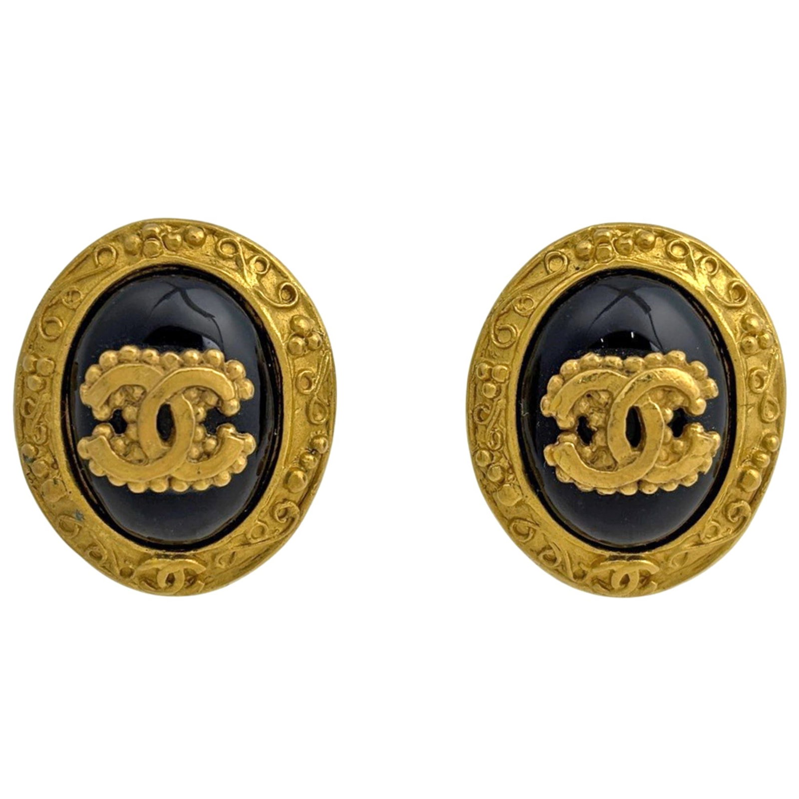 Coco Chanel Gold Oval Black Women's Mark Earrings GP: Coco Chanel Gold Oval Black Women's Mark Earrings GP Gold Oval Mark Earrings in Black from Chanel. Featuring a 23.00mm x 28.00mm oval shape with gold accents, these earrings showcase the iconic