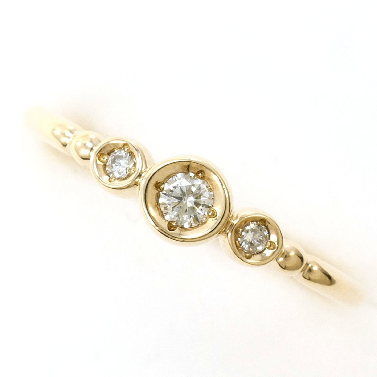 Unbranded Band Ring Yellow Gold (10K): Unbranded Band Ring Yellow Gold (10K) Yellow gold band ring with a diamond stone, weighing 0.05 carats, set in 10K yellow gold metal. This unbranded piece features a classic design and a subtle touch