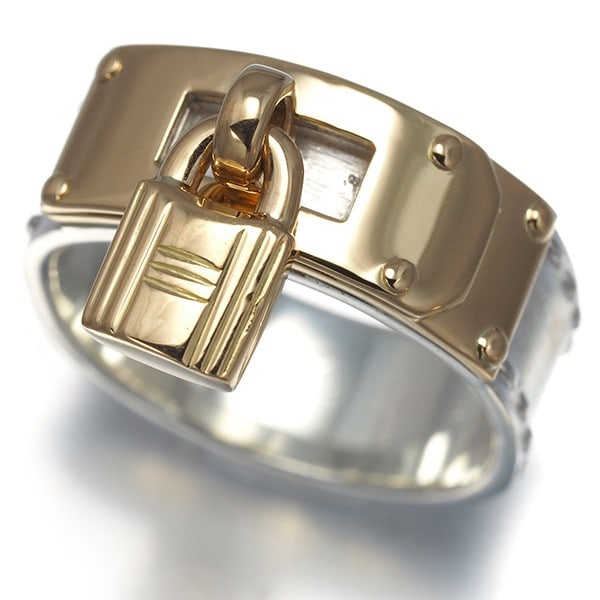Hermes Ring Kelly Padlock Eu54 925 Sterling Silver/ 18K 750 Yellow Gold: Hermes Ring Kelly Padlock Eu54 925 Sterling Silver/ 18K 750 Yellow Gold Sterling silver and 18K yellow gold come together in the elegant Hermes Ring Kelly Padlock Eu54, featuring a sleek design with a