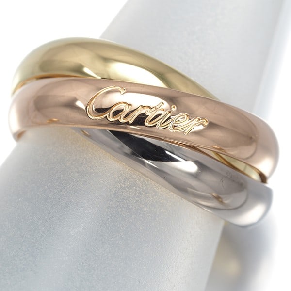 Cartier Ring Trinity 3Color Classic Eu49 18K 750 Yellow White Rose Gold: Cartier Ring Trinity 3Color Classic Eu49 18K 750 Yellow White Rose Gold Cartier's iconic Trinity ring boasts a sleek, multi-tone design featuring 18k yellow, white, and rose gold. The classic Eu49 sty