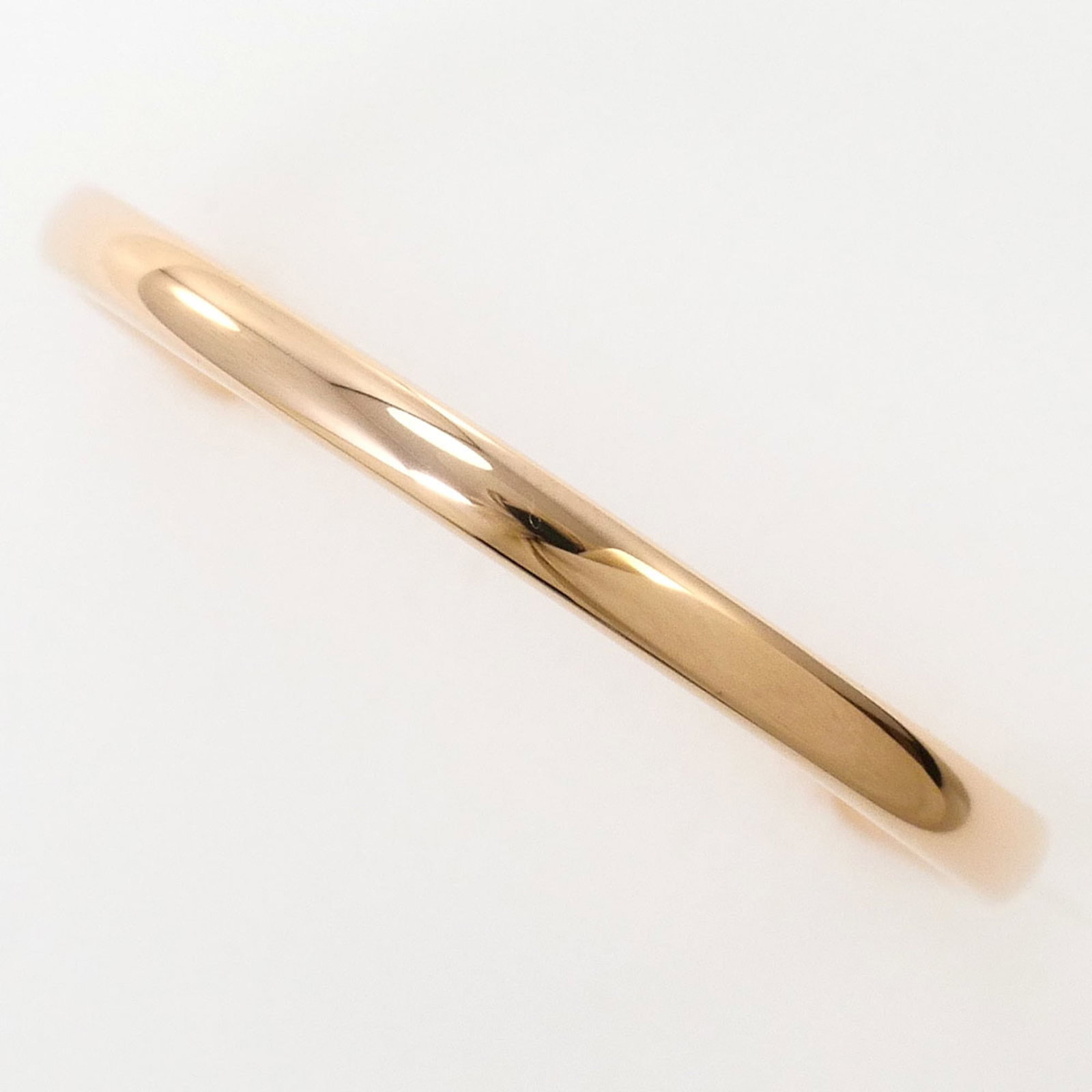 Pink Gold 14K Unbranded Band Ring: Pink Gold 14K Unbranded Band Ring Pink gold 14K band ring features a delicate, 2mm wide band with a subtle pink hue. Made from high-quality pink gold (14K), this unbranded ring boasts a classic
