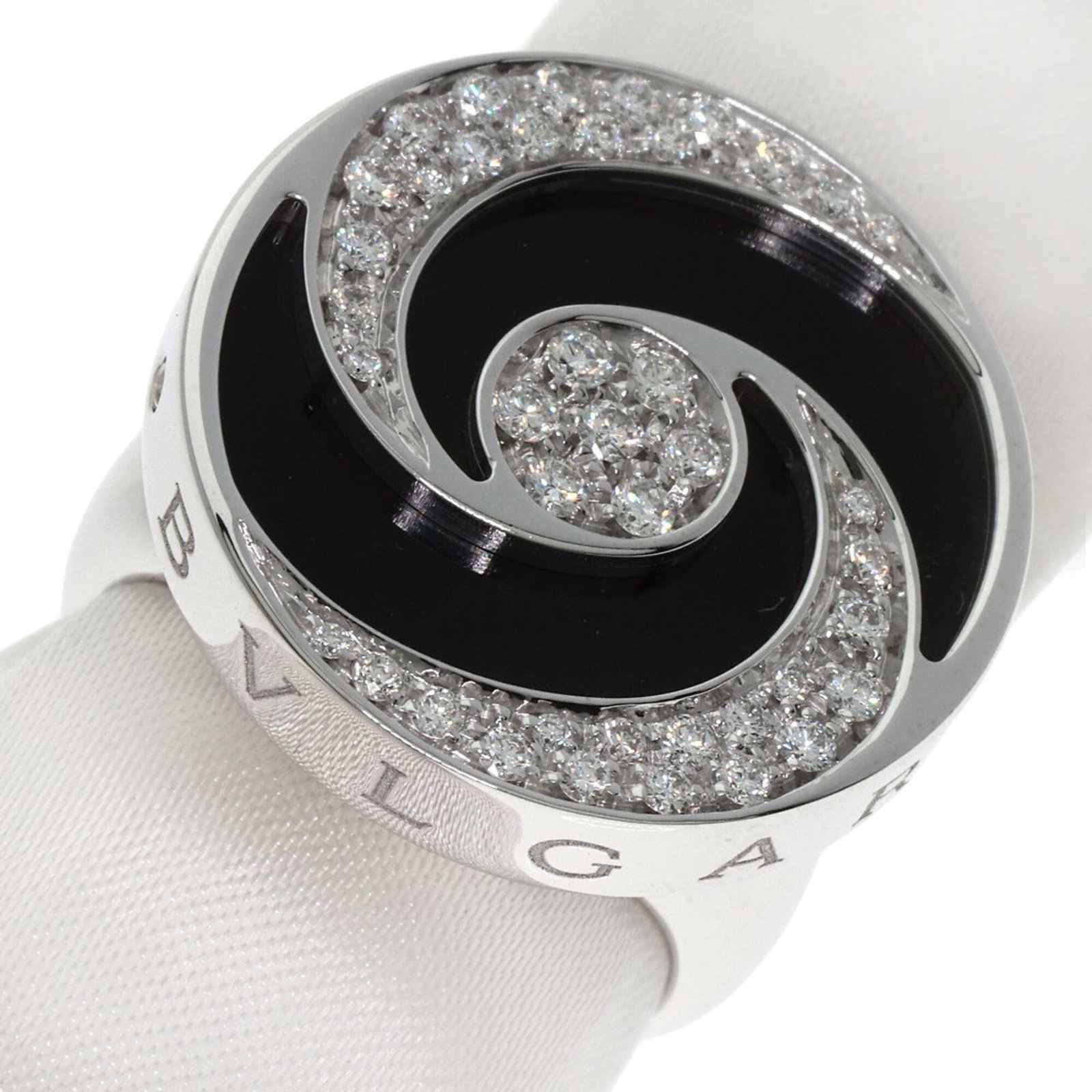 Bvlgari Band Ring: Bvlgari Band Ring Bvlgari Band Ring features an 18K white gold band adorned with a diamond and onyx stone, showcasing the luxury of Bvlgari's craftsmanship. This elegant ring boasts a classic design