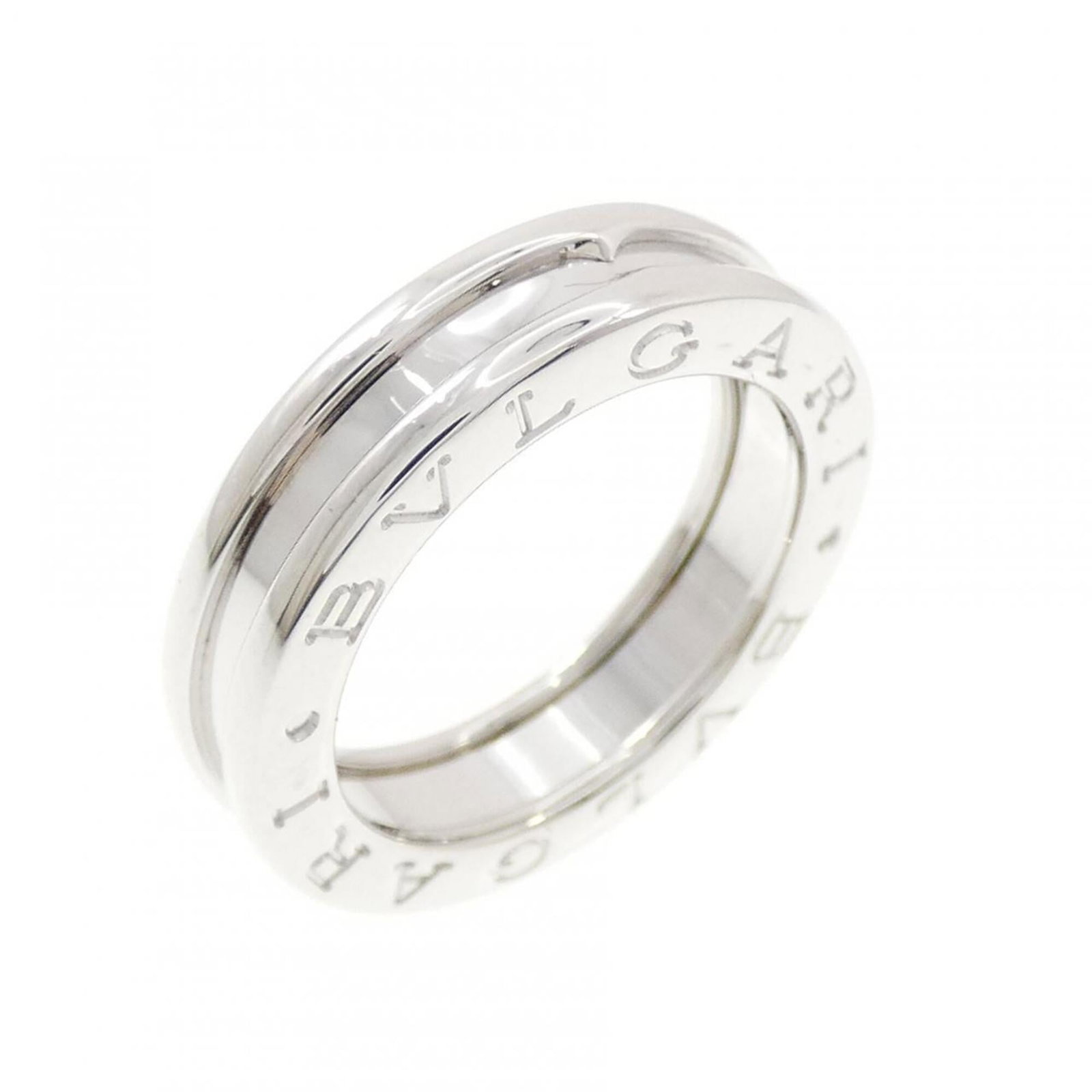 White Gold Bvlgari Ring Band: White Gold Bvlgari Ring Band White gold (18K) band ring from Bvlgari, featuring the iconic brand. This 48 US size, 4.5 band ring showcases the luxury of white gold craftsmanship. A timeless piece
