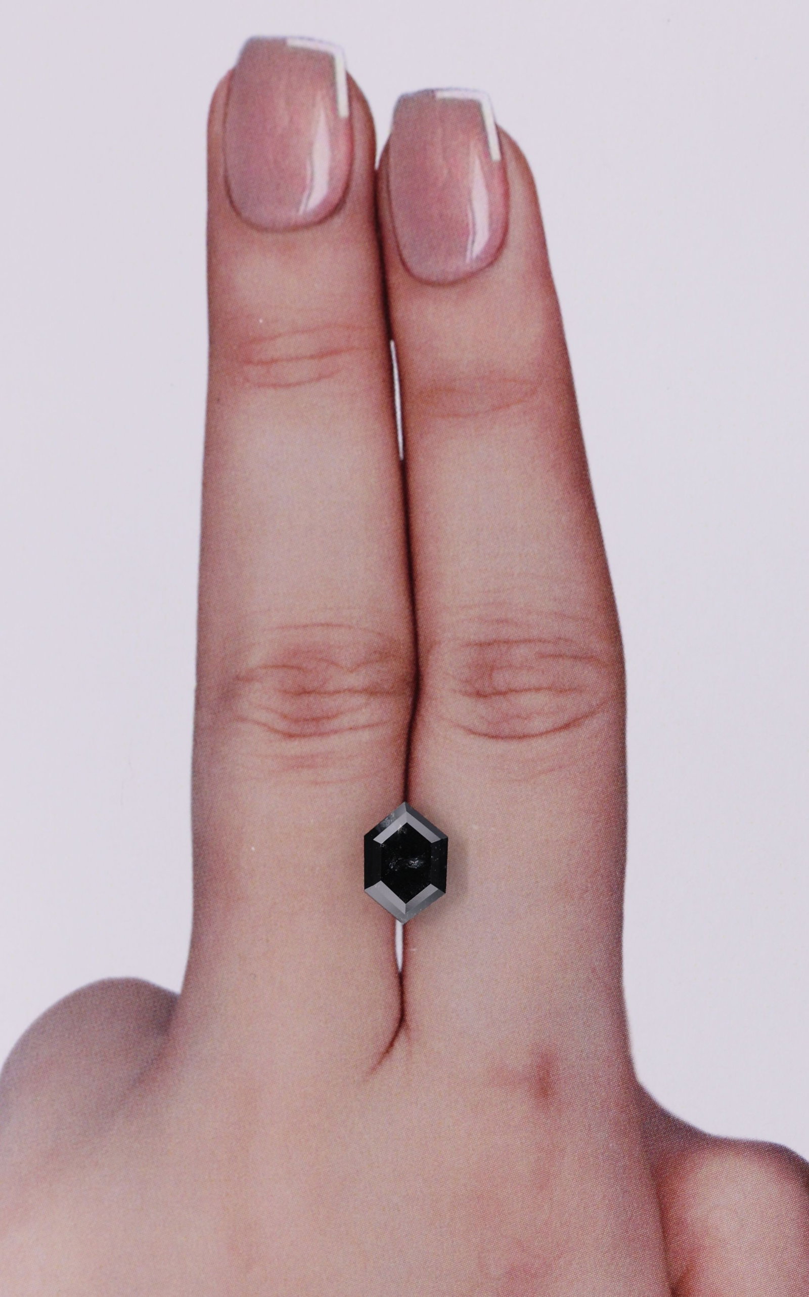 Hexagonal 1.55ct Fancy Black VVS2 - Loose Natural Diamond: Hexagonal 1.55ct Fancy Black VVS2 - Loose Natural Diamond The 1.55ct Fancy Black VVS2 diamond boasts exceptional clarity and polish, with its EX symmetry showcasing its precise cut. Measuring 8.77L x