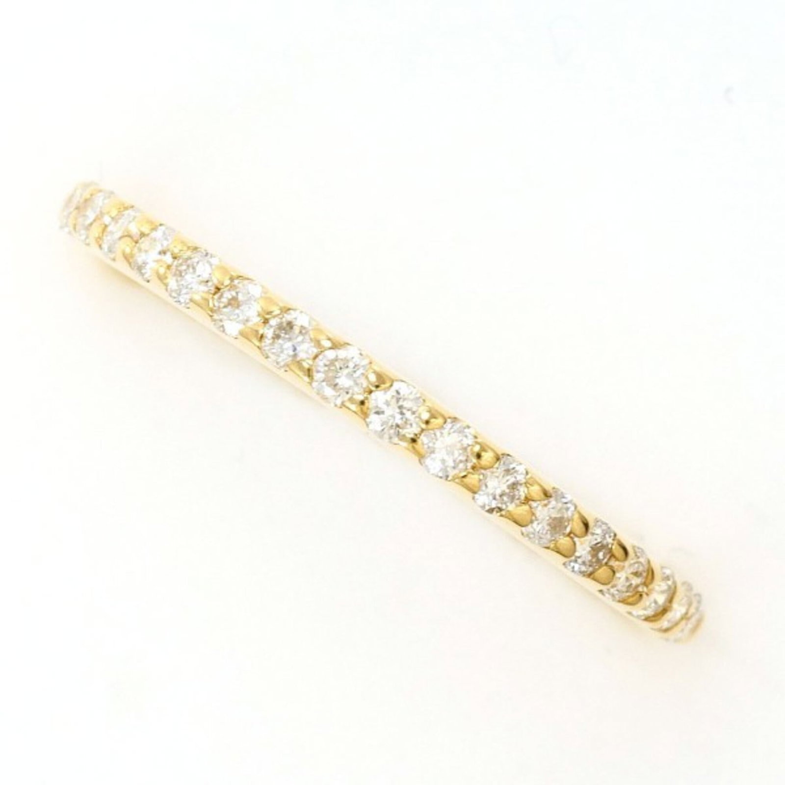 Unbranded Band Ring Yellow Gold (18K): Unbranded Band Ring Yellow Gold (18K) Yellow gold band ring with a diamond stone, weighing 0.19 carats, set in an 18K metal band with a US size 5 fit and a width of 1.5mm. This unbranded piece showcas