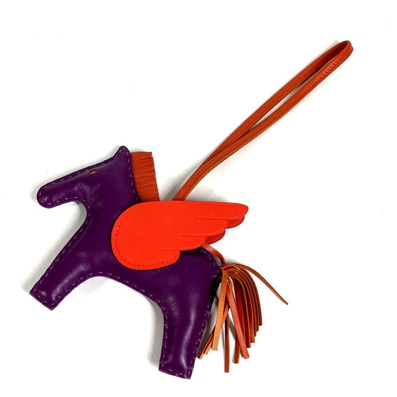 Hermes Charm Handbag Agneau Milo: Hermes Charm Handbag Agneau Milo Agneau Milo material gives the Agneau Milo handbag its distinctive look and feel. The purple and red color options add visual interest to this charming bag. Item Speci