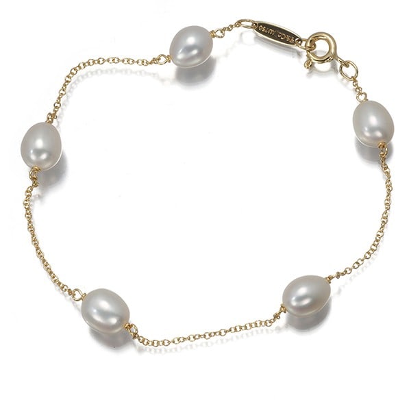 Tiffany&Co. by the yard station 18k YG freshwater pearl bracelet: Tiffany&Co. by the yard station 18k YG freshwater pearl bracelet Station 18k YG freshwater pearl bracelet by Tiffany&Co. features a cultured design with approximately 6.0 - 6.4mm freshwater pearls, cr
