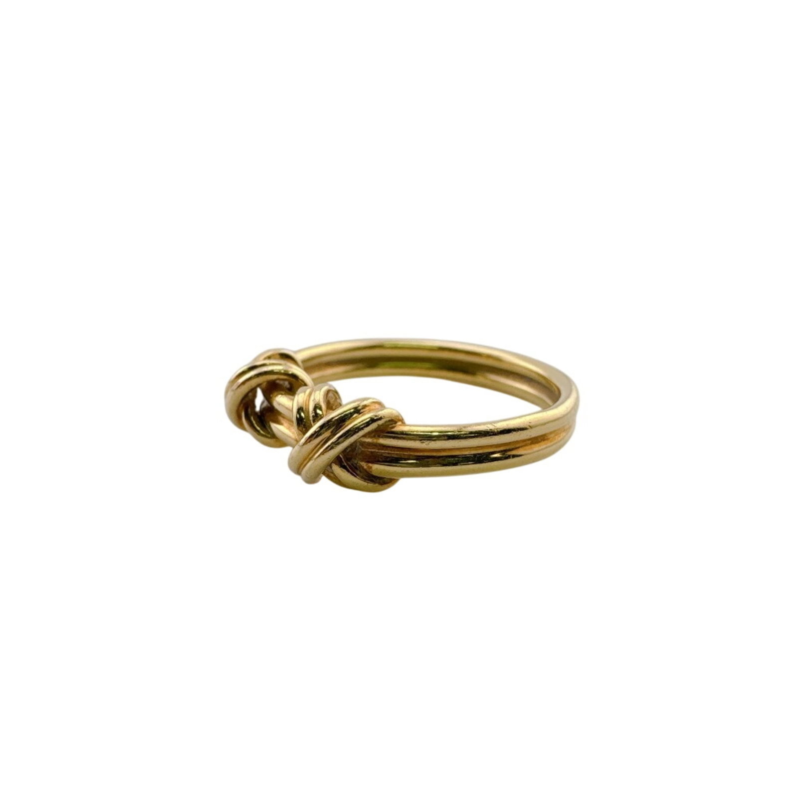 Yellow Gold 18K Tiffany Band Ring: Yellow Gold 18K Tiffany Band Ring Yellow gold 18K Tiffany band ring, available in US size 4.5, features a classic design made from high-quality yellow gold material. This elegant ring boasts a timeles