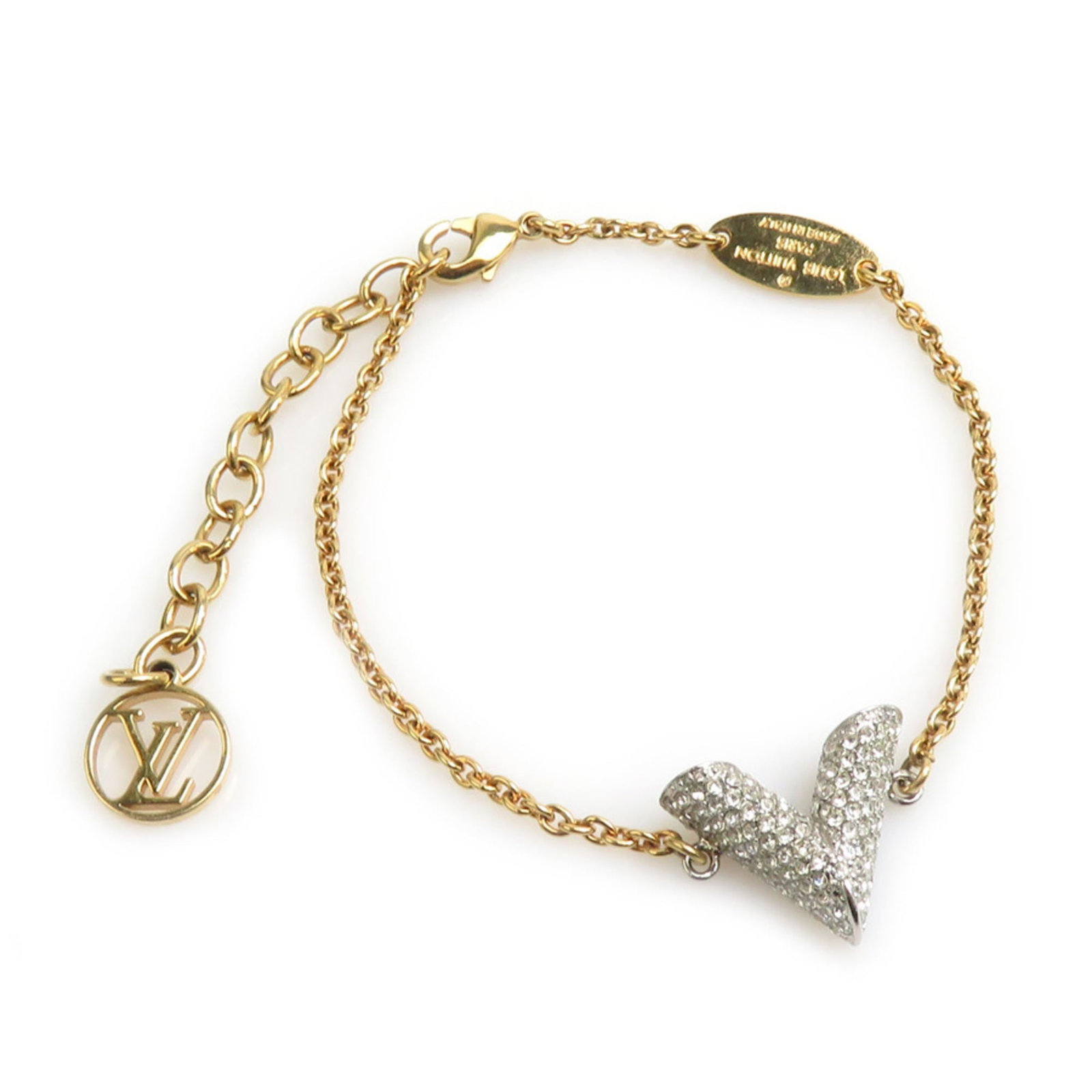 Louis Vuitton Metal Rhinestone Charm: Louis Vuitton Metal Rhinestone Charm Metal charm from Louis Vuitton featuring rhinestones in gold and silver hues, adding a touch of luxury to any outfit. The charm measures 14cm in length, making it