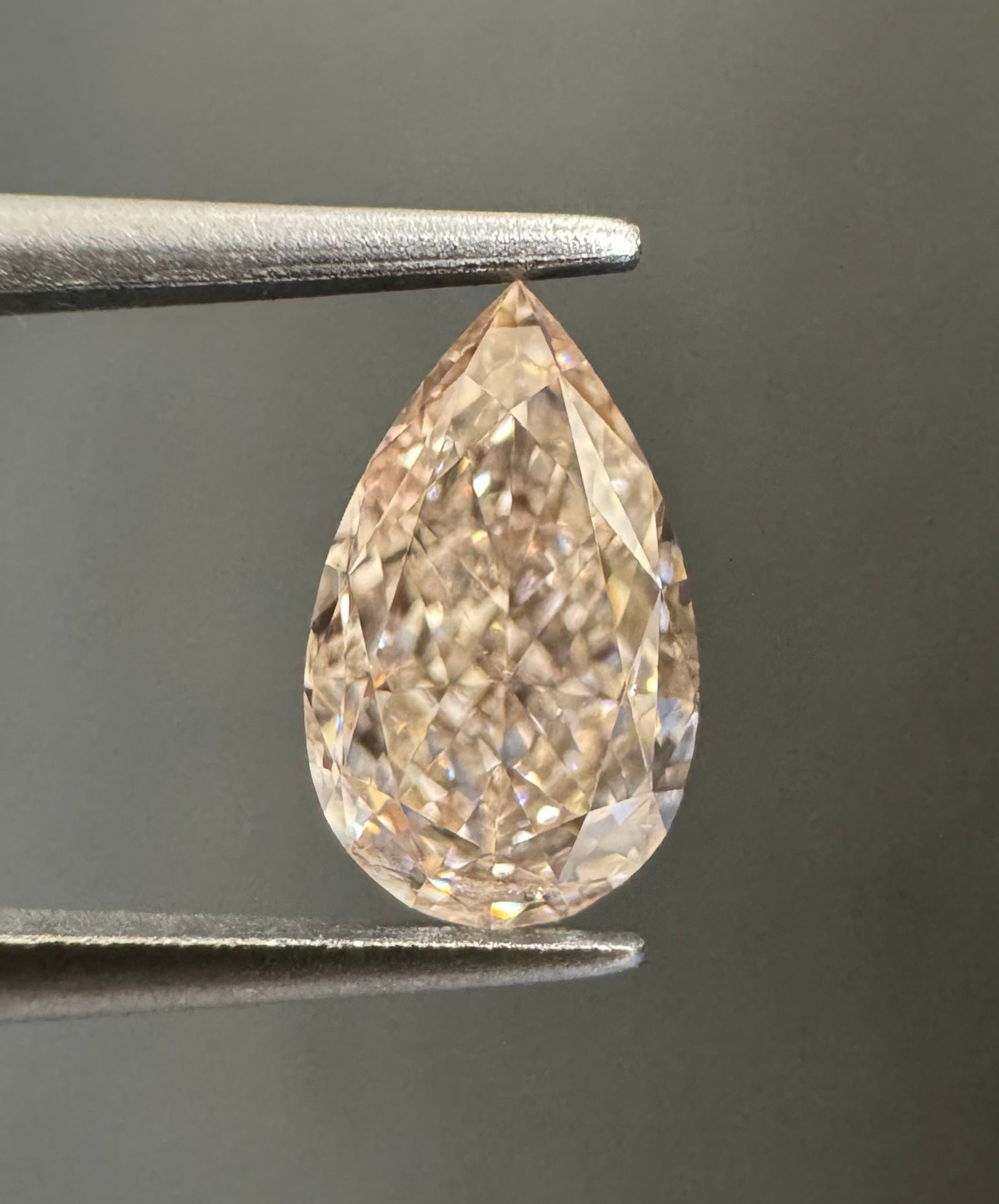 GIA Pear 0.65ct Fancy Light Pinkish Brown IF - Loose Natural Diamond: GIA Pear 0.65ct Fancy Light Pinkish Brown IF - Loose Natural Diamond GIA-certified Fancy Light Pinkish Brown IF diamond, measuring 0.65 carats in loose natural form, boasts an EX polish and VG