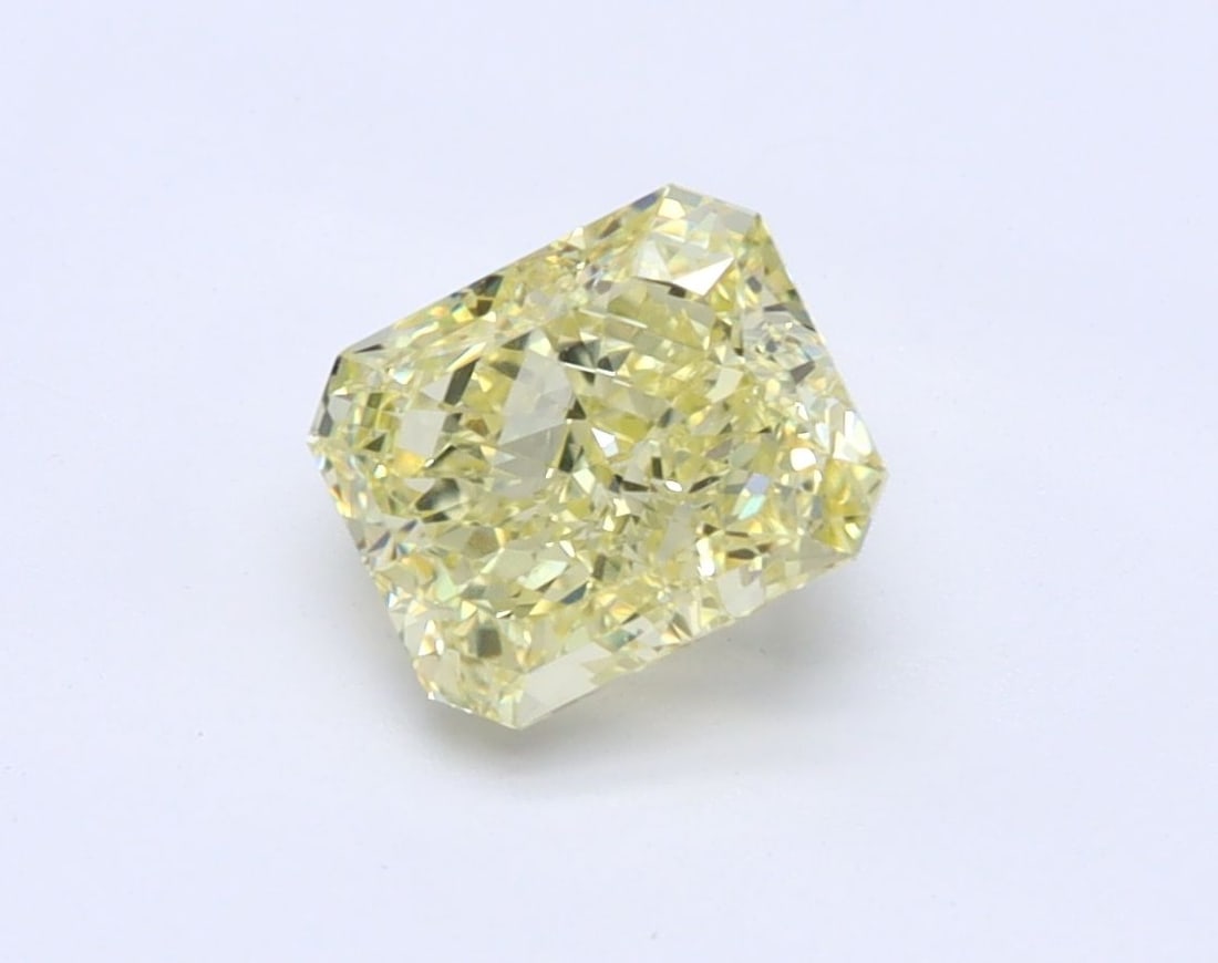 GIA Radiant 1.01ct Fancy Yellow VVS2 - Loose Natural Diamond: GIA Radiant 1.01ct Fancy Yellow VVS2 - Loose Natural Diamond GIA certified, this loose natural diamond boasts a vibrant Fancy Yellow color and exceptional clarity, graded VVS2. Its high polish and sym
