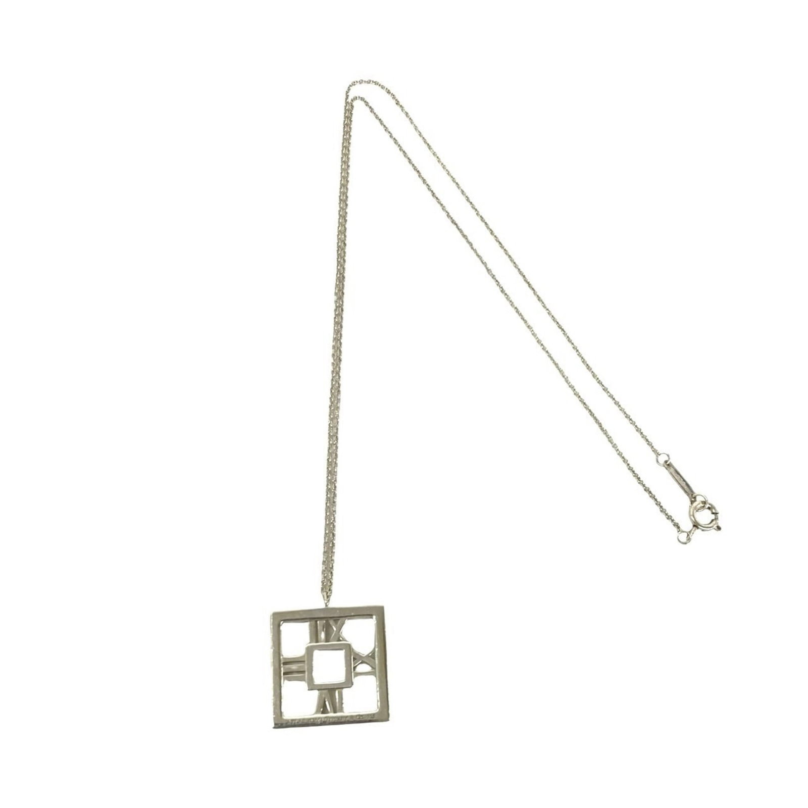 Vintage Atlas Necklace Sterling Silver Accessory 925 Tiffany Co.: Vintage Atlas Necklace Sterling Silver Accessory 925 Tiffany Co. Sterling silver necklace with a vintage atlas pendant, bearing the hallmark of Tiffany Co. The 41cm chain and 18mm x 18mm pendant make