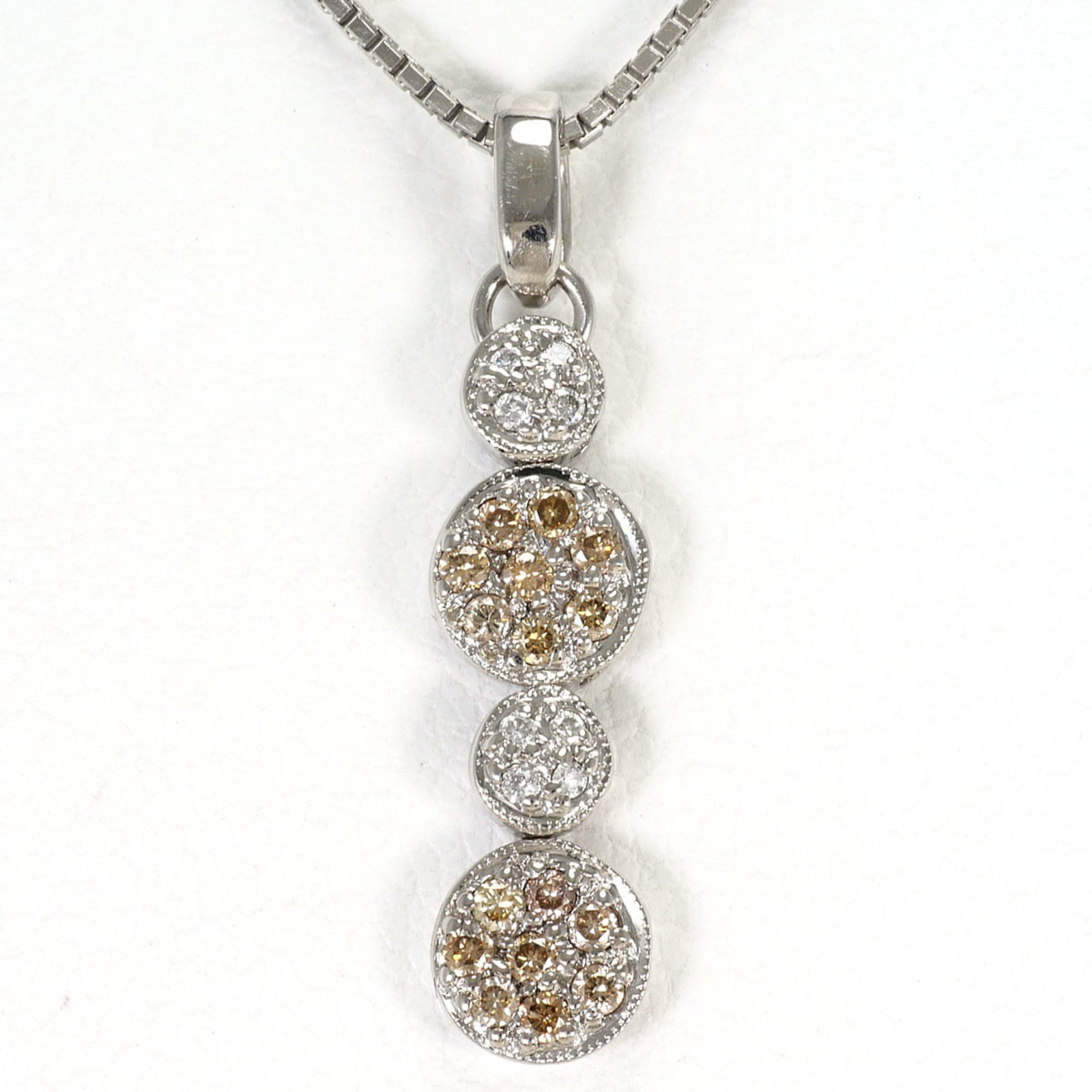 18K (18-Karat White Gold) Necklace With Brown Diamond (No Carat Marking) And Marking). Includes: 18K (18-Karat White Gold) Necklace With Brown Diamond (No Carat Marking) And Marking). Includes 18K white gold necklace with a stunning brown diamond pendant, crafted from high-quality metal. The neck