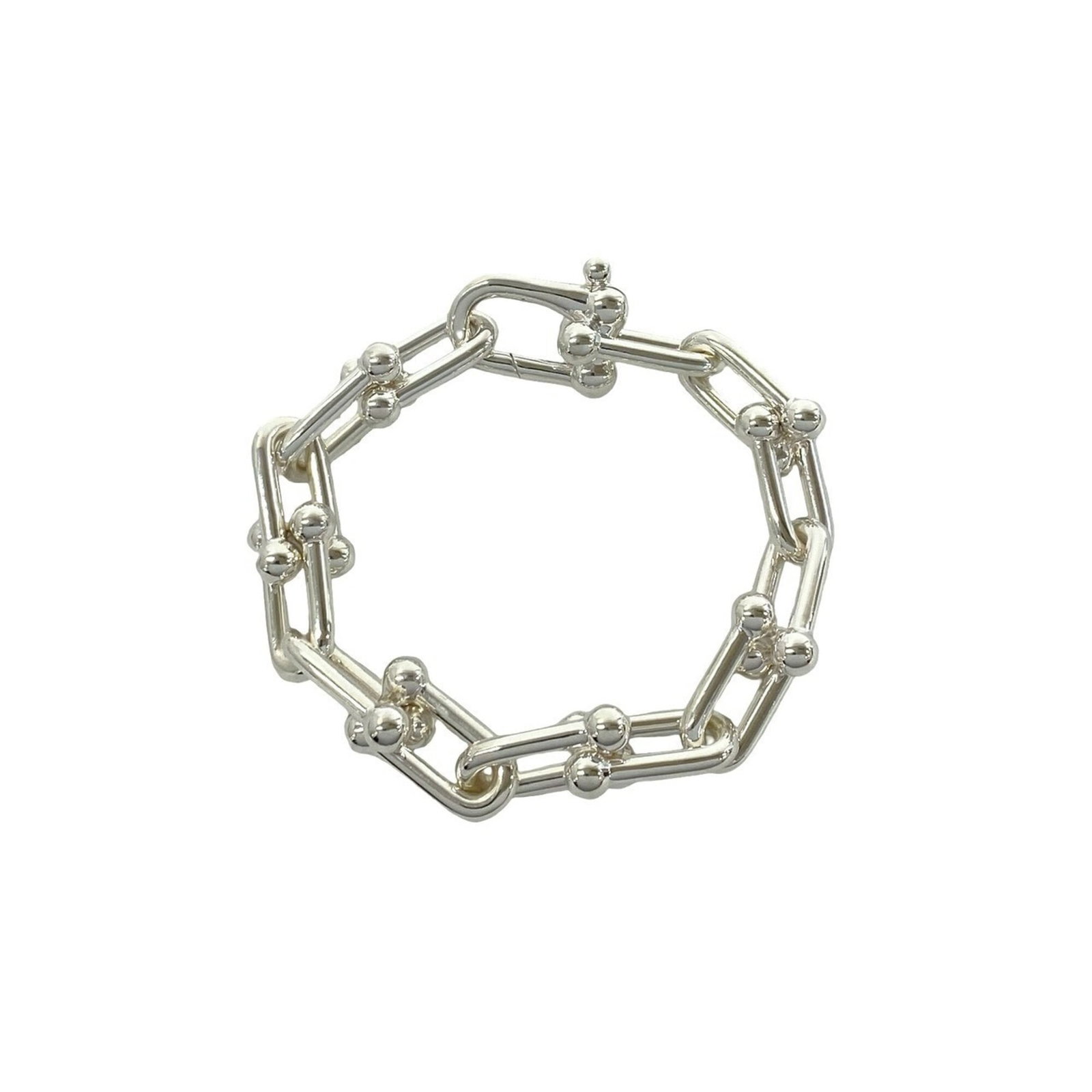 Tiffany Charm Bracelet Silver 925: Tiffany Charm Bracelet Silver 925 Silver 925 Tiffany Charm Bracelet, 20.7cm in length, features the iconic brand's charm bracelet design made from high-quality silver material. This elegant piece is