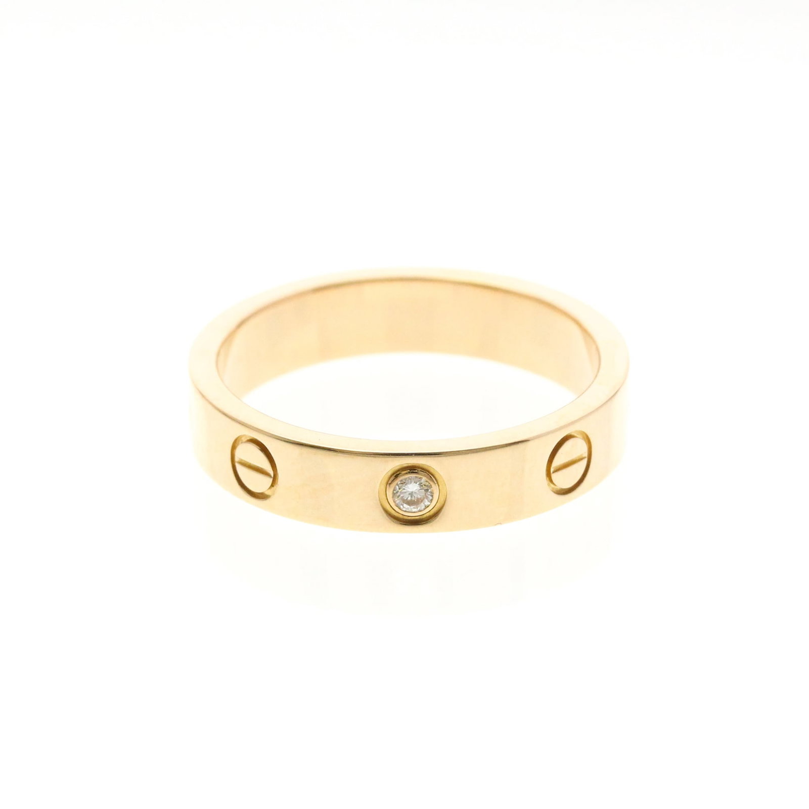 Pink Gold Cartier Band Ring 18K: Pink Gold Cartier Band Ring 18K Pink Gold Cartier Band Ring 18K features a striking pink gold design with a diamond set into the band, creating a beautiful and elegant look. Made from high-quality 18K