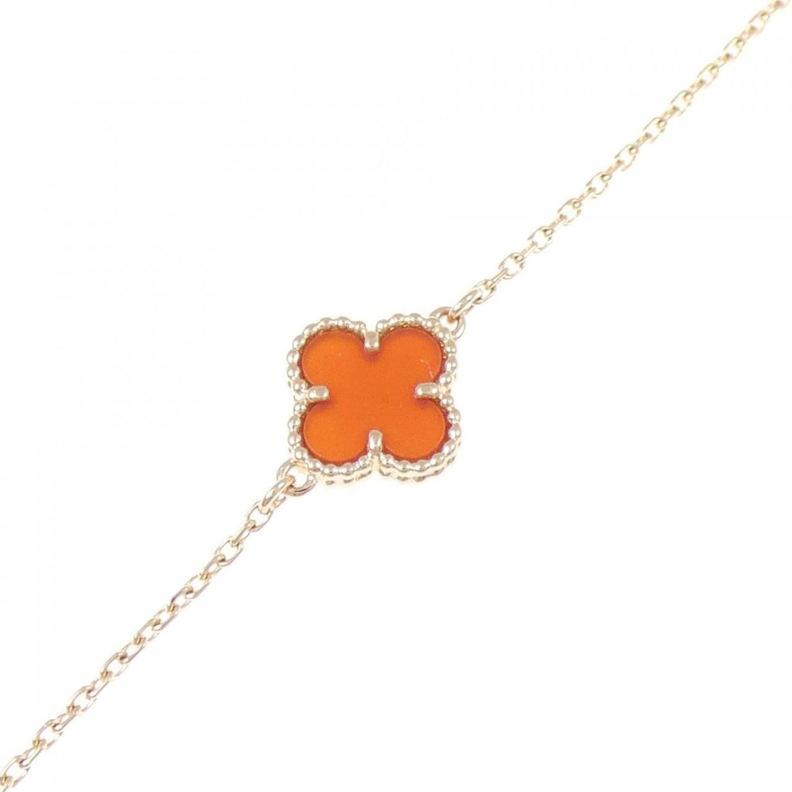 Pink Gold 18K Charm Van Cleef Arpels: Pink Gold 18K Charm Van Cleef Arpels Pink gold 18K charm bracelet from Van Cleef & Arpels, featuring a signature and a beautiful carnelian stone. This elegant piece measures 16.5cm - 18cm in length. A