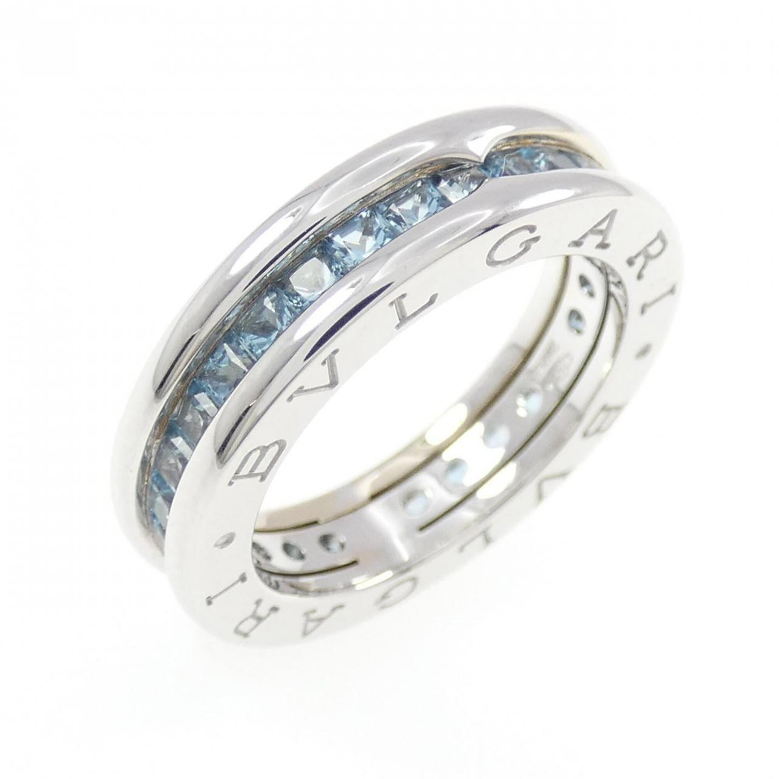 White Gold Bvlgari Ring Band: White Gold Bvlgari Ring Band White gold (18K) band ring from Bvlgari, featuring topaz stone and a size 5 fit. This elegant ring showcases the luxury of Italian design, with its sleek white gold