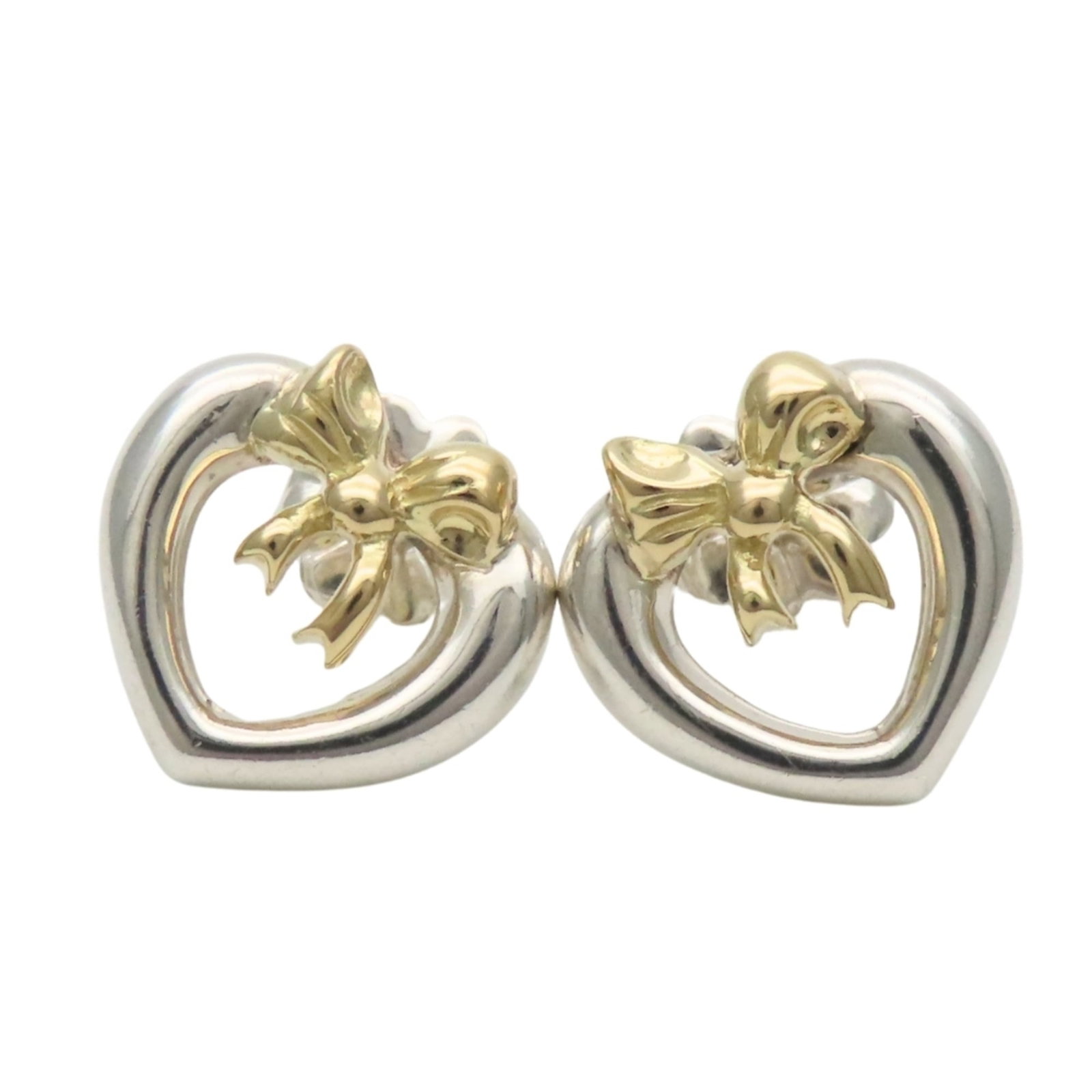 Tiffany Stud Earrings Silver 925 Yellow Gold (18K): Tiffany Stud Earrings Silver 925 Yellow Gold (18K) Silver and yellow gold stud earrings from Tiffany, measuring 11.30mm x 11.60mm with a weight of 3g. Made from high-quality materials, these earrings