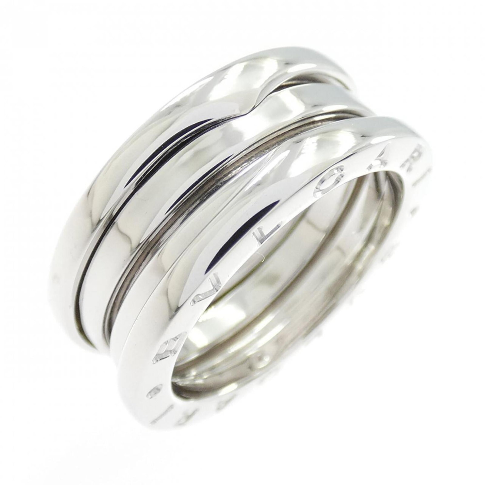 White Gold Bvlgari Ring Band: White Gold Bvlgari Ring Band White gold Bvlgari ring band, crafted from 18K white gold, features the iconic brand's signature style. This elegant band boasts a classic design that complements any