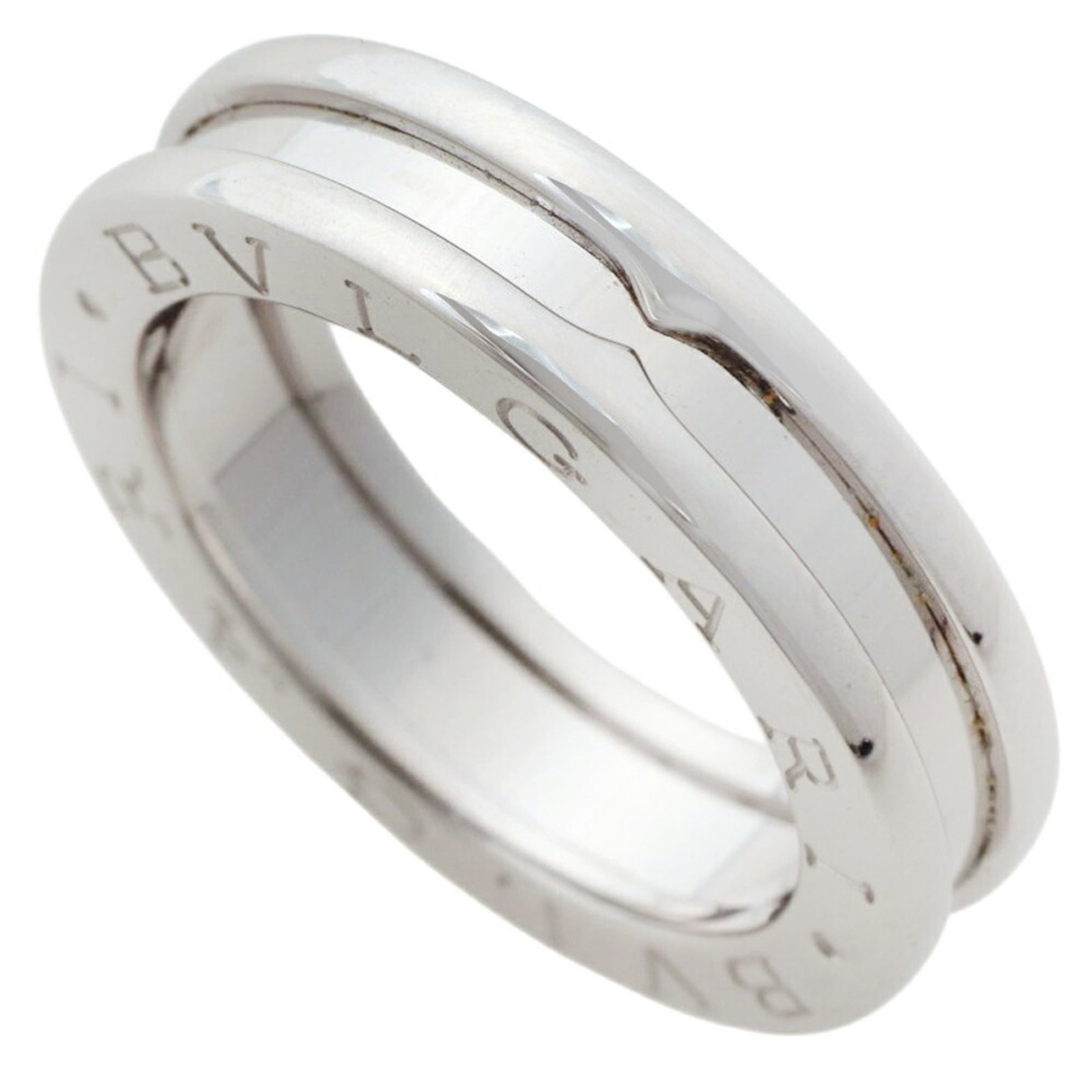 White Gold Bvlgari Ring Band: White Gold Bvlgari Ring Band White gold Bvlgari ring band with 18K white gold construction, available in size 4.5 and US size 48. This band features the iconic Bvlgari brand. Item Specifics: Brand: