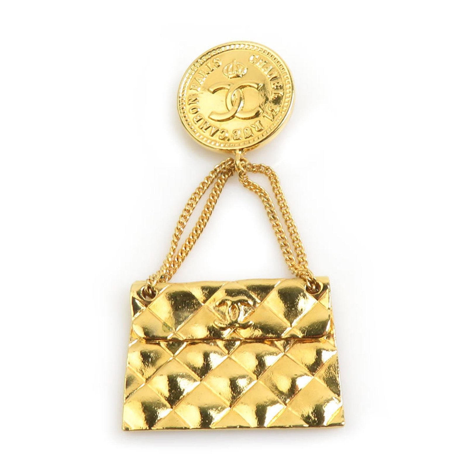 Metal brooch by Chanel: Metal brooch by Chanel Metal brooch by Chanel, crafted from gold and measuring 7.5cm x 3.3cm, boasts a sleek design that showcases the iconic French brand's signature style. Made entirely of metal