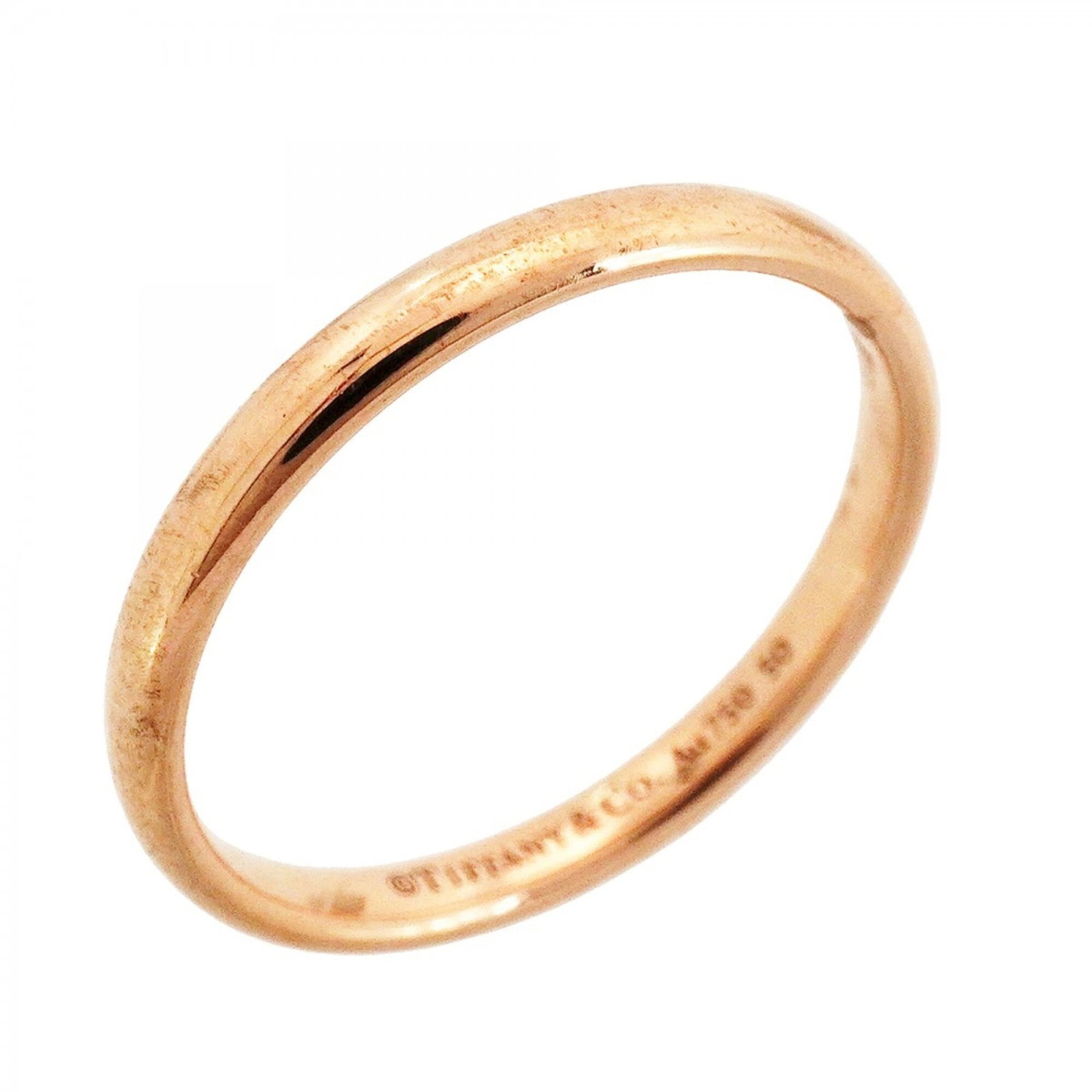 Pink Gold Tiffany Ring Band: Pink Gold Tiffany Ring Band Pink gold (18K) Tiffany ring band, available in US size 8.5, features the iconic brand's signature style with a touch of elegance. The 18K pink gold material adds a