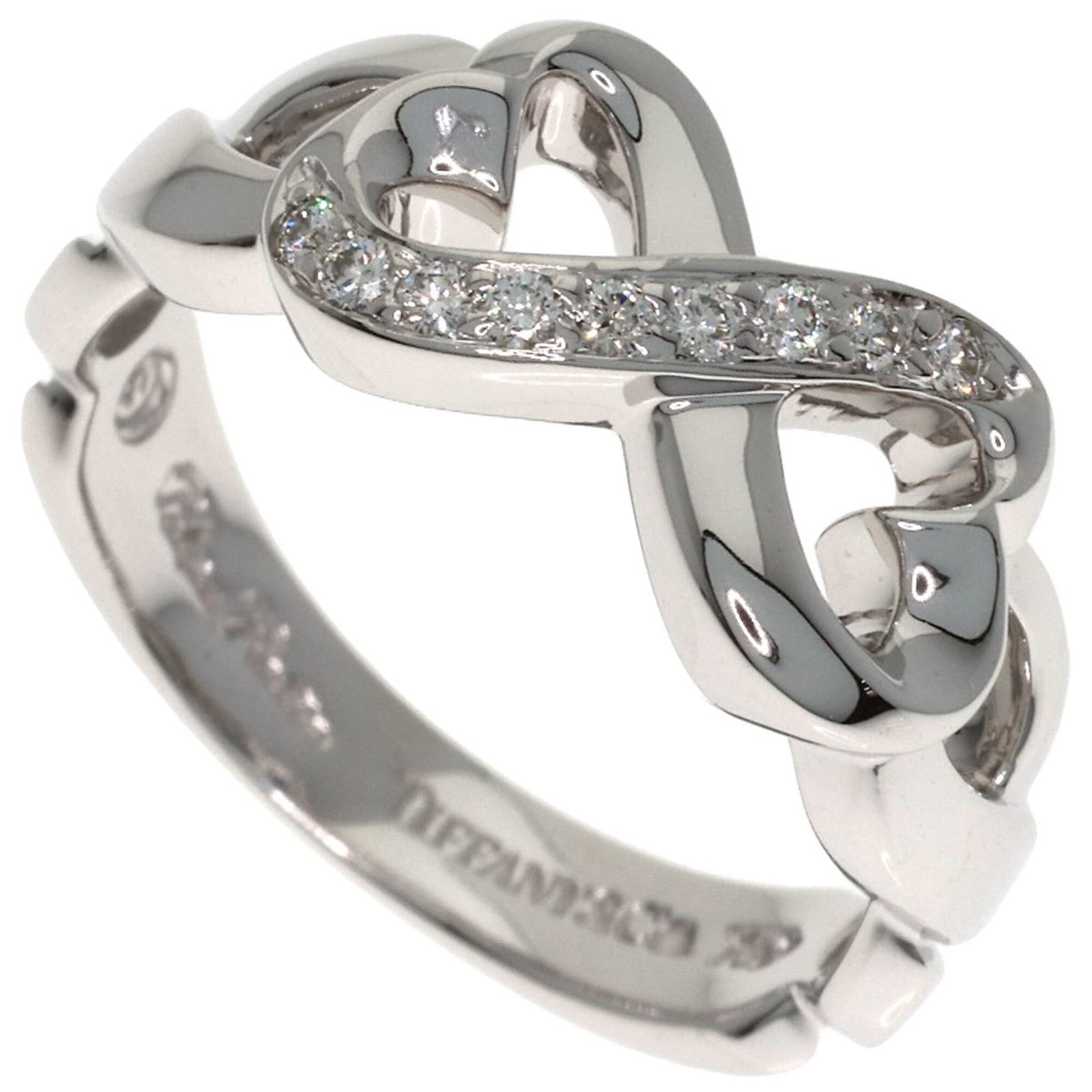 White Gold 18k Tiffany Band Ring: White Gold 18k Tiffany Band Ring White gold 18k Tiffany band ring features a diamond stone and is made from high-quality white gold, weighing 4.7g. This elegant ring is available in US size 4.5. The r