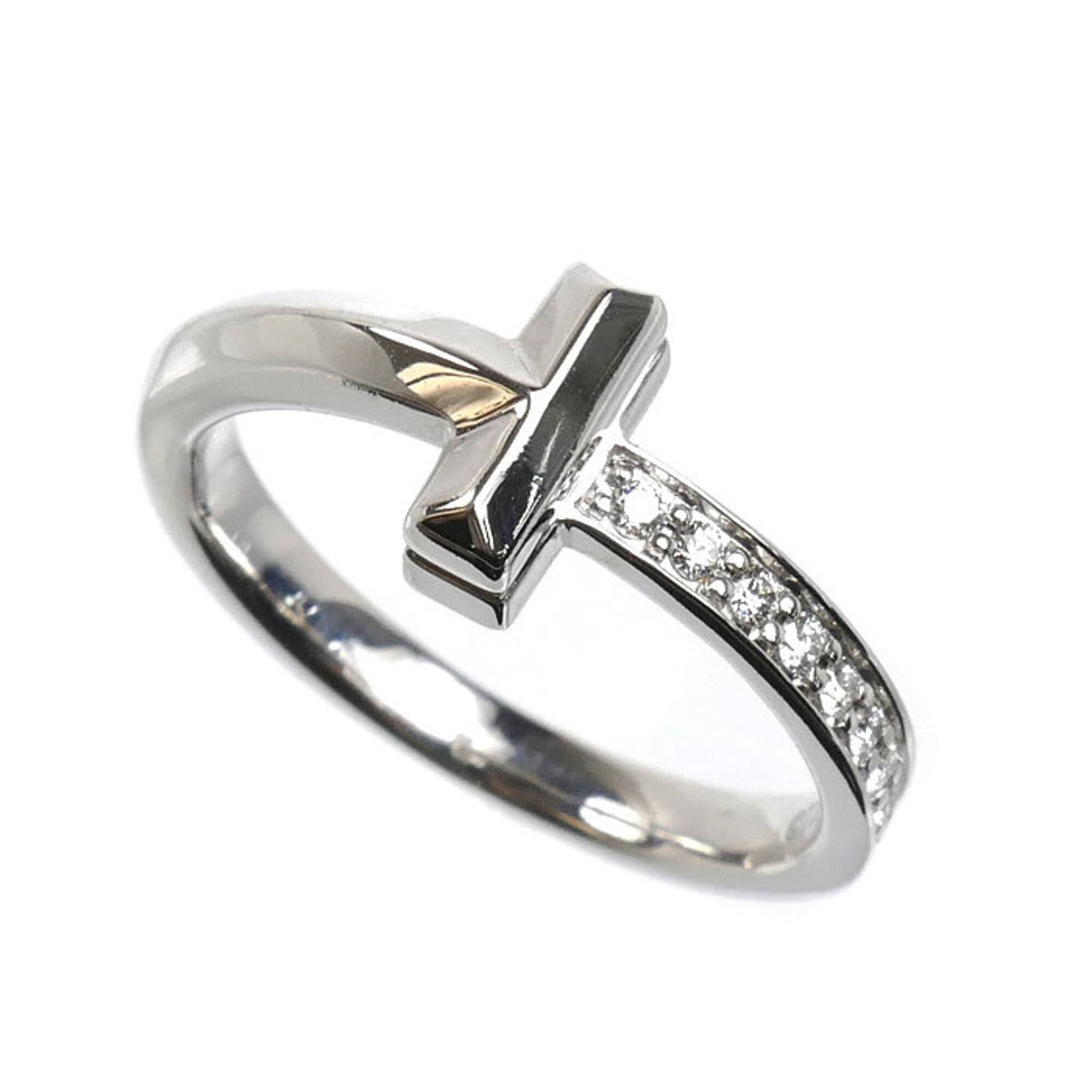 Tiffany Band Ring White Gold (18K): Tiffany Band Ring White Gold (18K) Tiffany & Co.'s iconic band ring in 18K white gold features a diamond stone, crafted to perfection with a classic design that exudes timeless elegance. This US-made