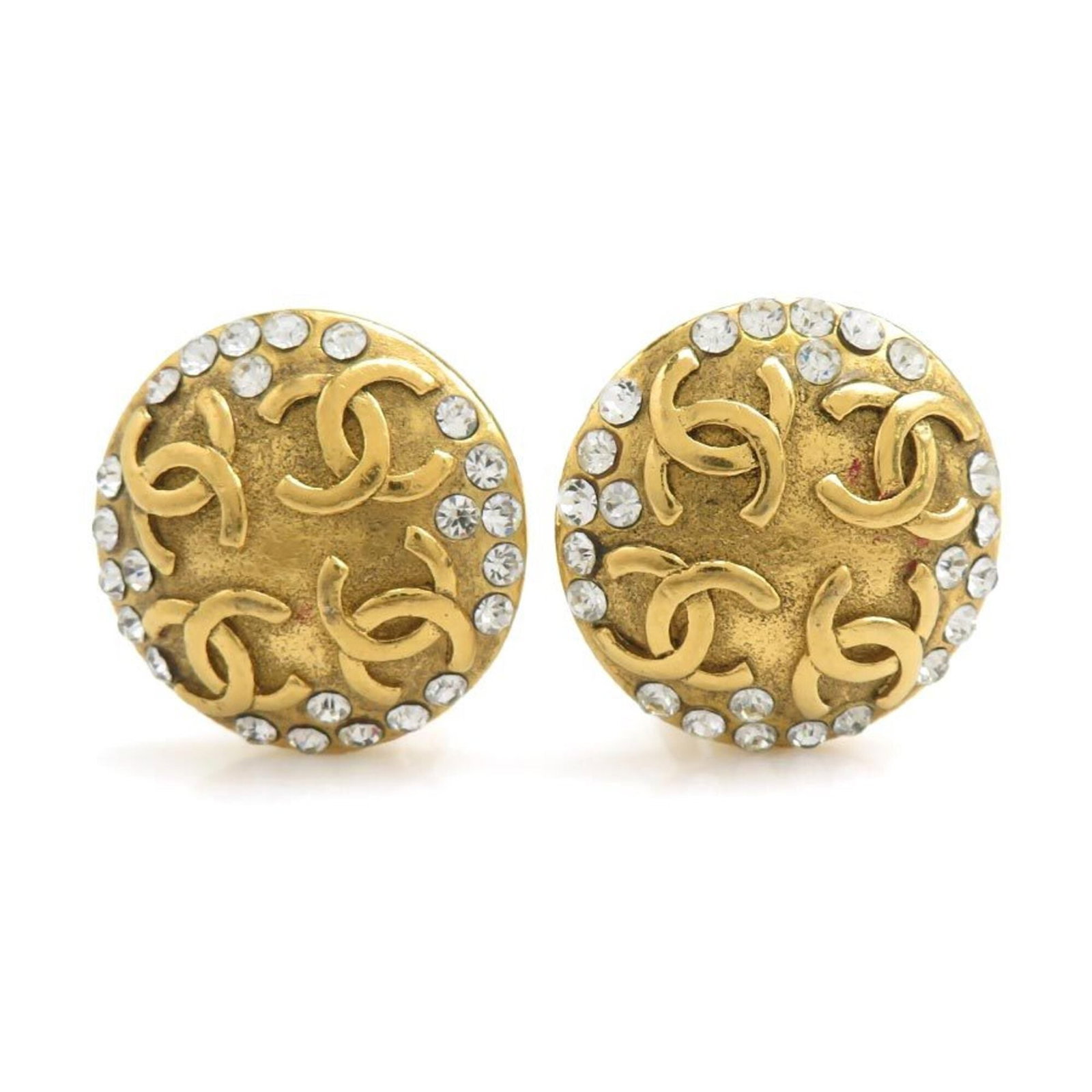 Chanel Clip Earrings Metal Rhinestone: Chanel Clip Earrings Metal Rhinestone Metal Rhinestone Clip Earrings from Chanel, crafted in France with intricate details. The gold and silver metalwork showcases an abundance of rhinestones, adding 