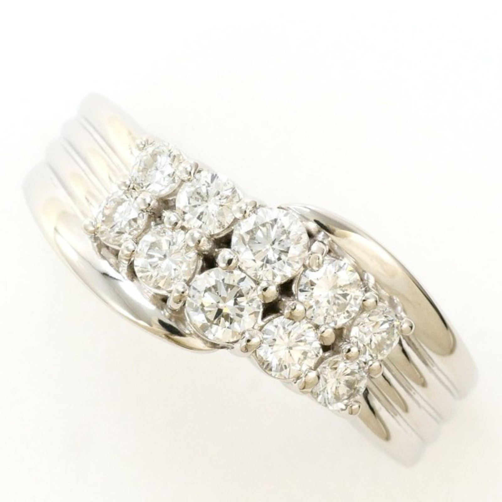 Unbranded Band Ring Platinum 900: Unbranded Band Ring Platinum 900 Platinum 900 band ring features a diamond stone weighing 0.53 carats, set in a platinum metal construction with a US size 5 fit and width of 8mm. The ring's weight is 