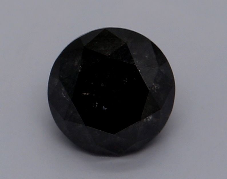 GIA Round 0.84ct Fancy Black VVS2 - Loose Natural Diamond: GIA Round 0.84ct Fancy Black VVS2 - Loose Natural Diamond The GIA Round 0.84ct Fancy Black VVS2 diamond boasts exceptional clarity and color, with its EX polish and symmetry showcasing a masterful cut