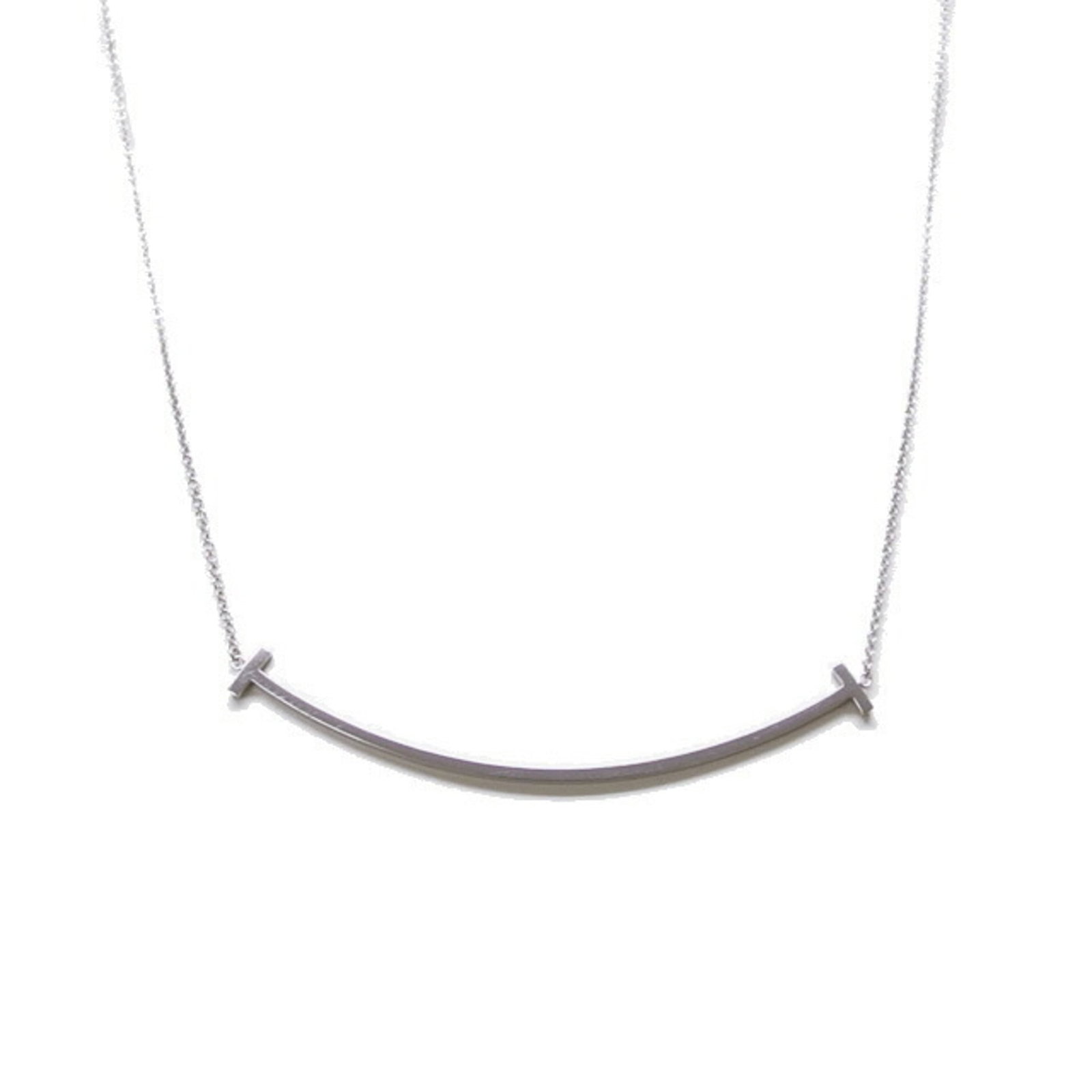 Tiffany & Co. T Smile Pendant Large 18K White Gold: Tiffany & Co. T Smile Pendant Large 18K White Gold Tiffany & Co. T Smile Pendant Large in 18K White Gold boasts a striking design, featuring a large pendant with a 15mm x 70mm size and a sleek 40.5 cm