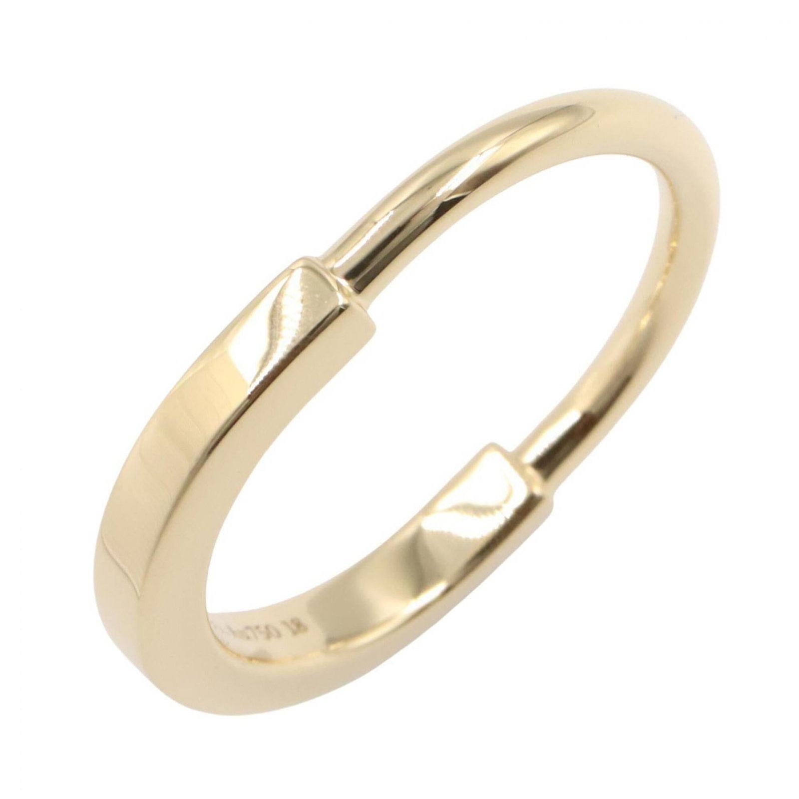 Yellow Gold 18K Tiffany Band Ring: Yellow Gold 18K Tiffany Band Ring Yellow gold 18K Tiffany band ring, available in US size 8.5, features a classic design with a subtle shine from the 18K yellow gold material. The ring's simplicity ma
