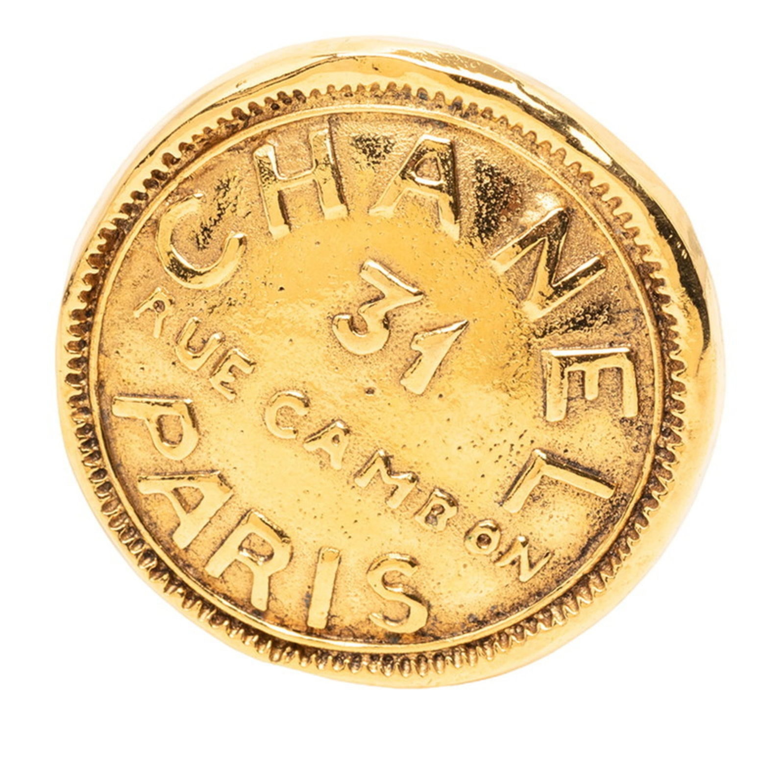 Chanel Brooch: Chanel Brooch Chanel's iconic gold brooch boasts sleek dimensions, measuring 3.53cm x 3.49cm / 1.38'' x 1.37''. The piece's compact size makes it a stylish addition to any outfit. Its classic design i