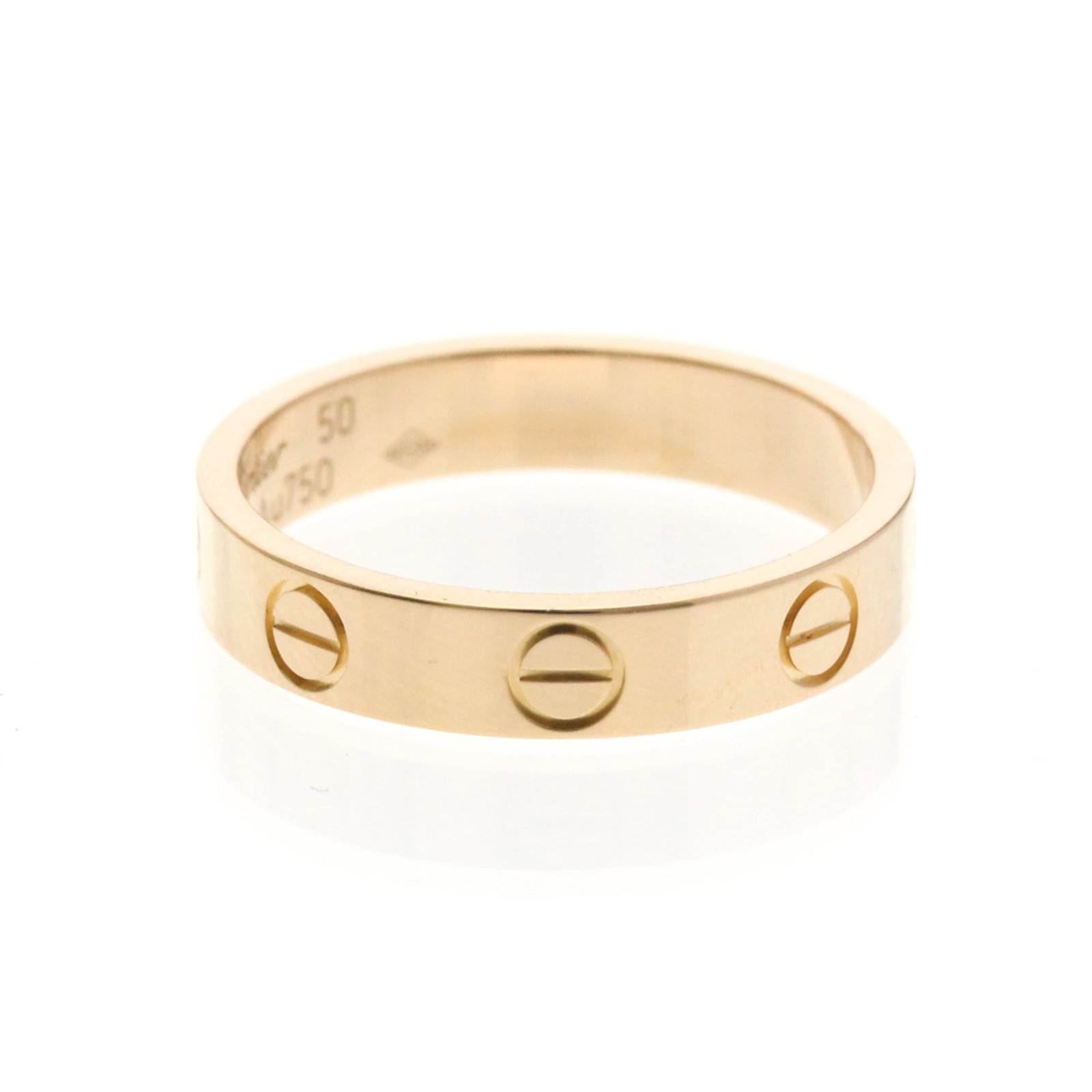 Pink Gold Cartier Band Ring 18K: Pink Gold Cartier Band Ring 18K Pink gold Cartier band ring in 18K, featuring a slender 3.5mm width and a weight of 3g. This elegant piece boasts a pink gold material with no stone, making it a simple