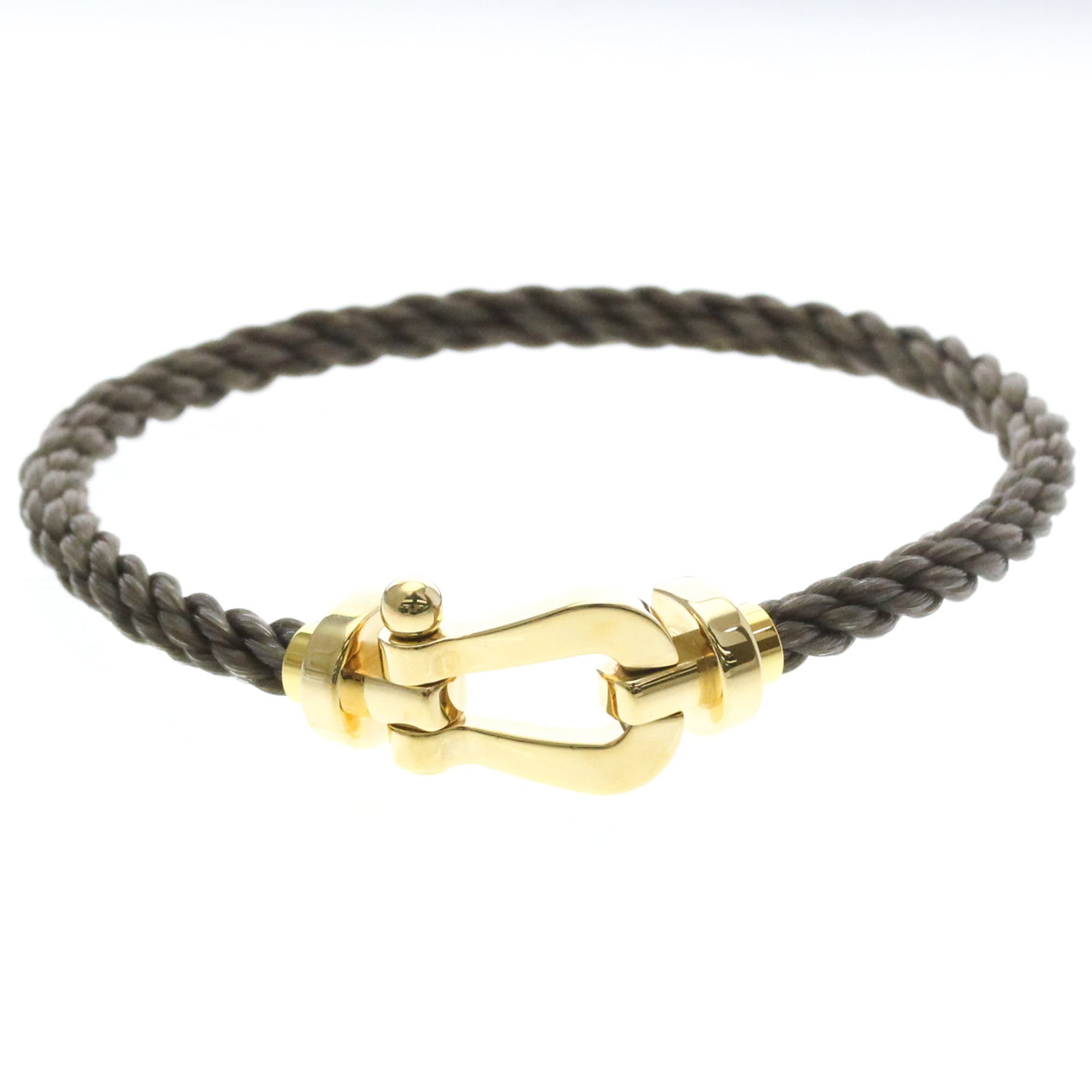 Charm Bracelet Yellow Gold 18K Fred: Charm Bracelet Yellow Gold 18K Fred Yellow gold (18K) charm bracelet with a sleek, fashion-forward design. This 18cm long chain features no stone and weighs approximately 10.8g. Made from high-quality