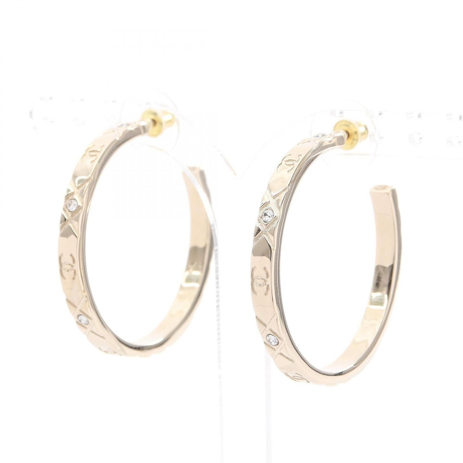 Chanel Hoop Earrings Gold Plating Rhinestone: Chanel Hoop Earrings Gold Plating Rhinestone Gold plating and rhinestones add luxury to these sleek hoop earrings from Chanel, featuring a sophisticated gold finish. The 40mm diameter hoops are adorne