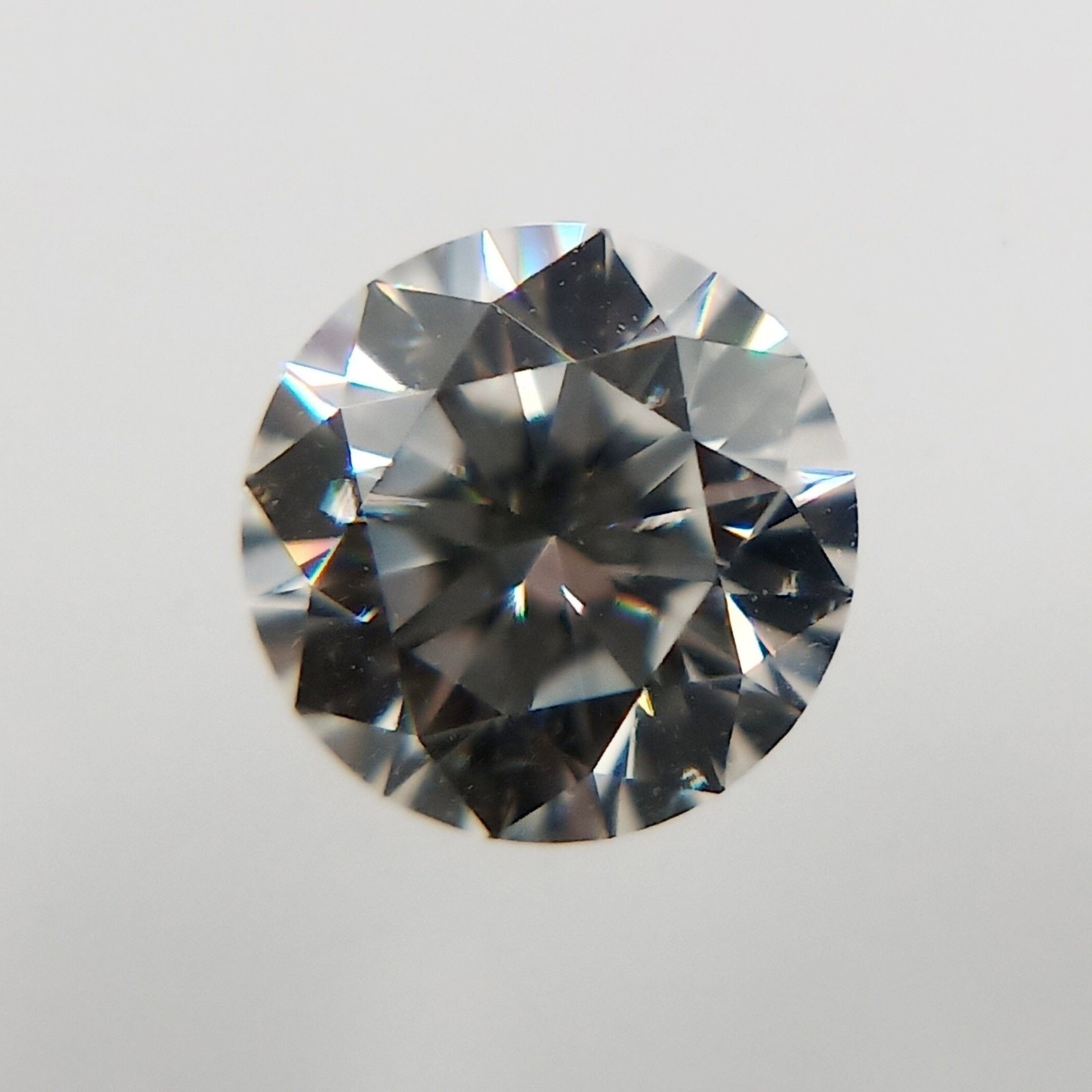 GIA Round 0.24ct G VVS2 - Loose Natural Diamond: GIA Round 0.24ct G VVS2 - Loose Natural Diamond The GIA Round 0.24ct G VVS2 diamond boasts exceptional clarity and color, with an EX polish and symmetry that showcase its natural beauty. Certified by 