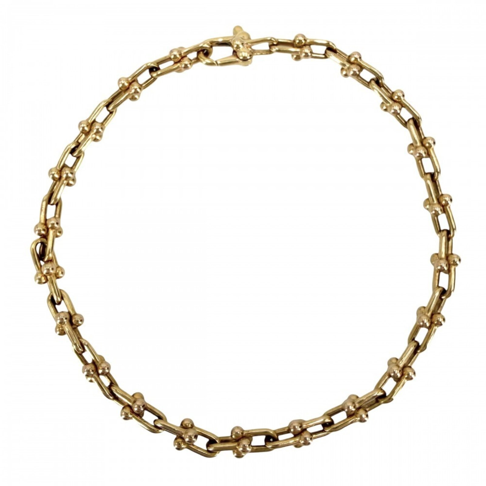 Tiffany Charm Bracelet Yellow Gold (18K): Tiffany Charm Bracelet Yellow Gold (18K) Yellow gold (18K) charm bracelet from Tiffany, featuring a classic design with a length of 16.5cm / 6.49''. This elegant piece showcases the timeless appeal of