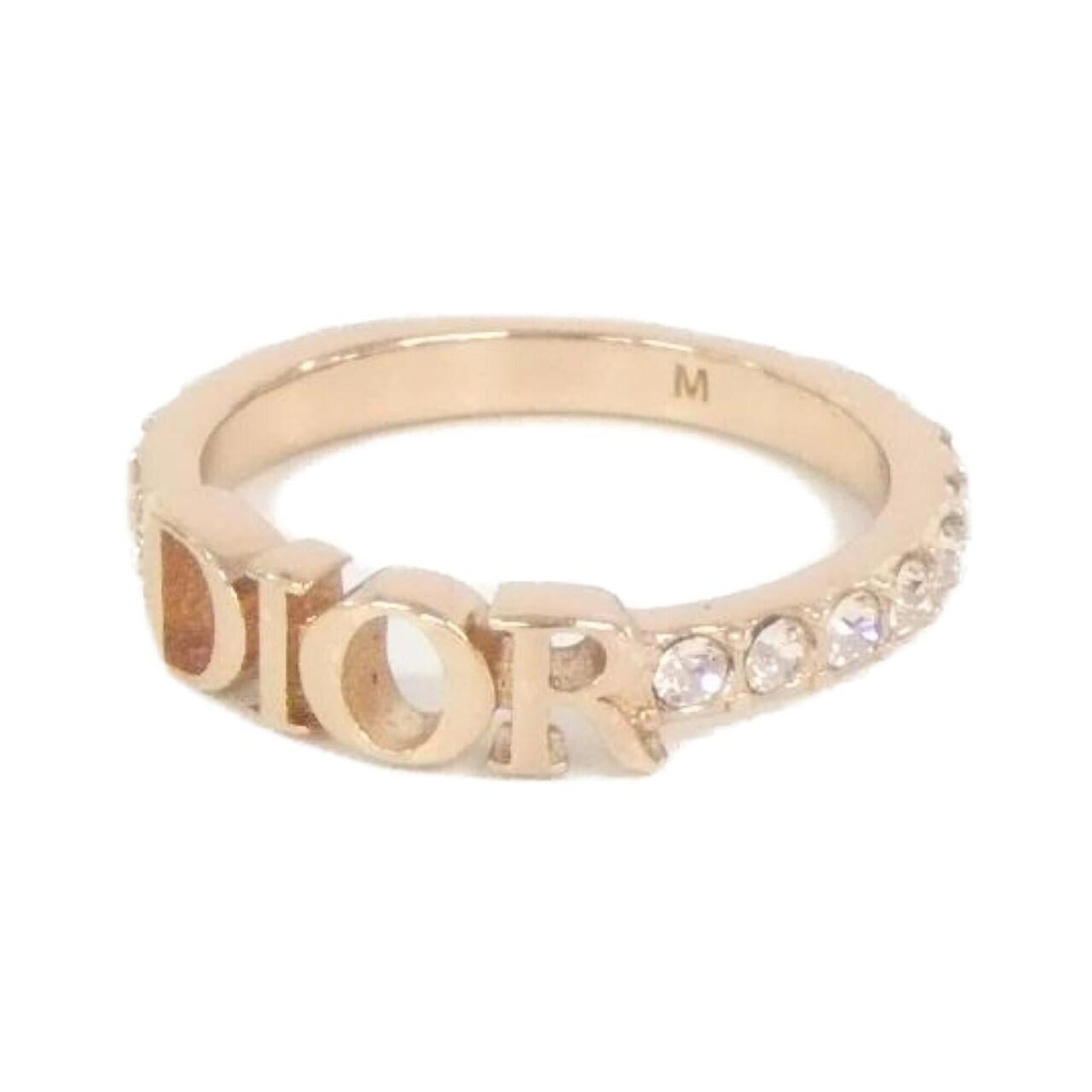 Dior Ring by Christian Band: Dior Ring by Christian Band Clear, pink gold Dior ring by Christian Dior features a signature. This band ring is available in US size 6.5 and comes in clear pink gold. Item Specifics: Brand: