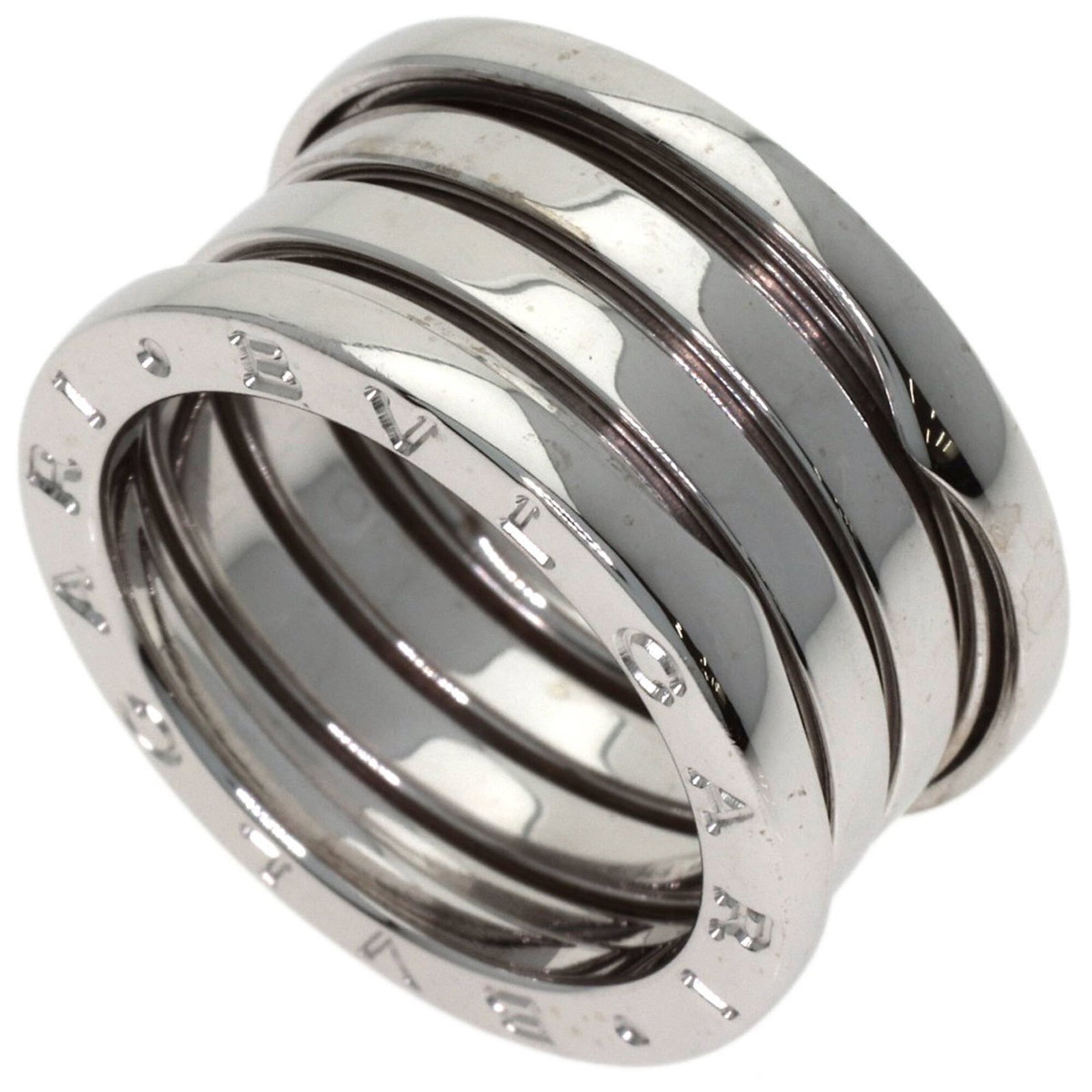 White Gold Bvlgari Ring Band: White Gold Bvlgari Ring Band White gold (18K) band ring from Bvlgari, available in US size 6.5. This elegant ring features a classic design that complements a variety of styles, with its simple yet so